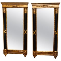 Pair of Italian Hollywood Regency Ebony 
Gilt Decorated Wall or Console Mirrors