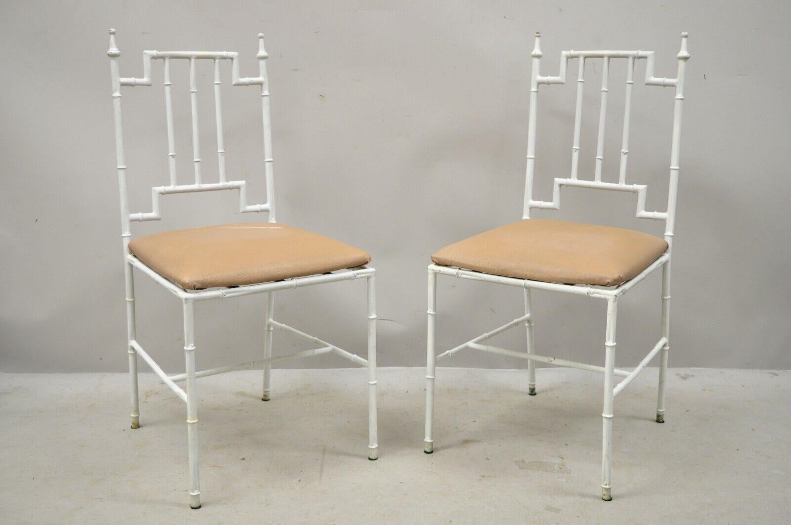 Pair of vintage Italian Hollywood Regency white faux bamboo metal accent side chairs, circa mid-20th century. Measurements: 34.5