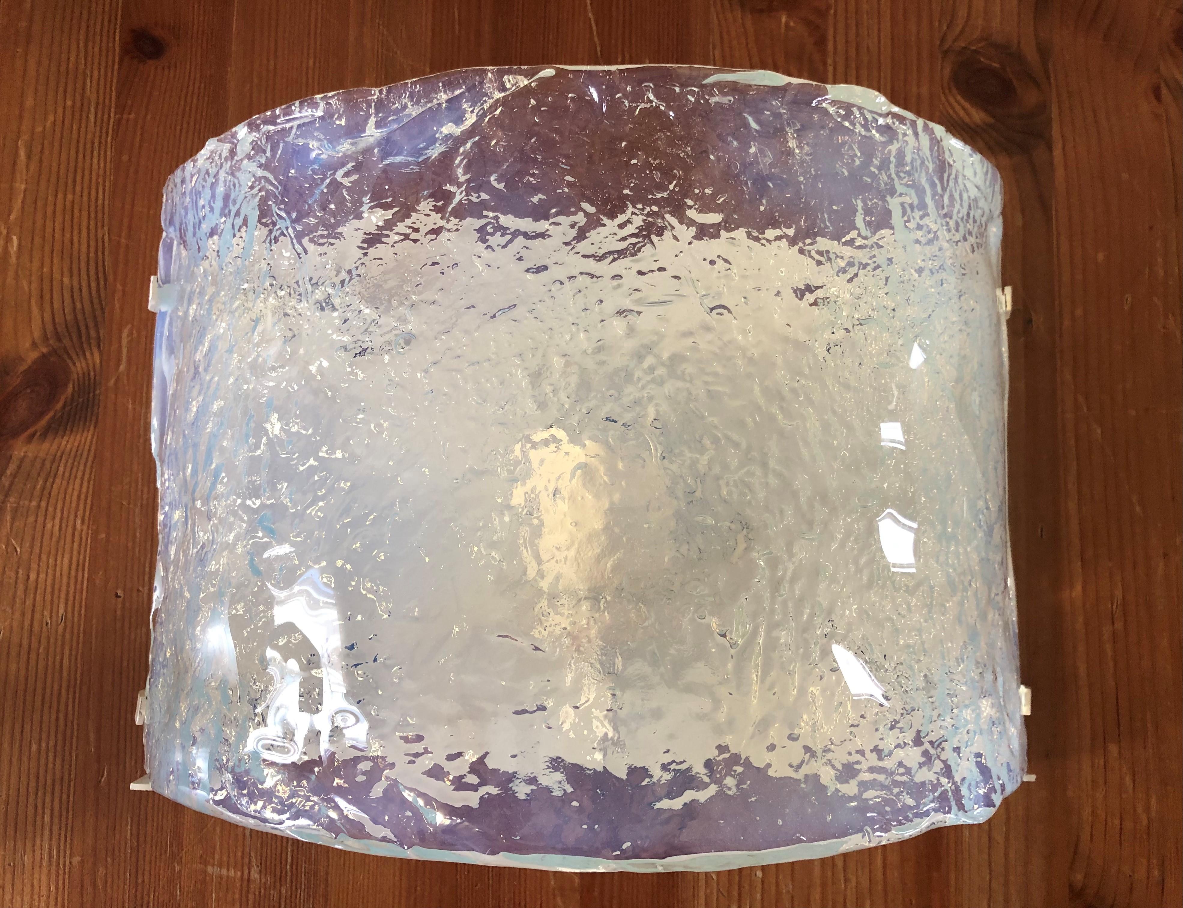Beautify and unique Pair of Italian Iridescent Murano glass Wall Sconces from 1970s by Carlo Nason for AV Mazzega.
These Sconces were designed and manufactured during the 1970s in Italy for the Venice Company “AV Mazzega” by Carlo Nason as Designer.