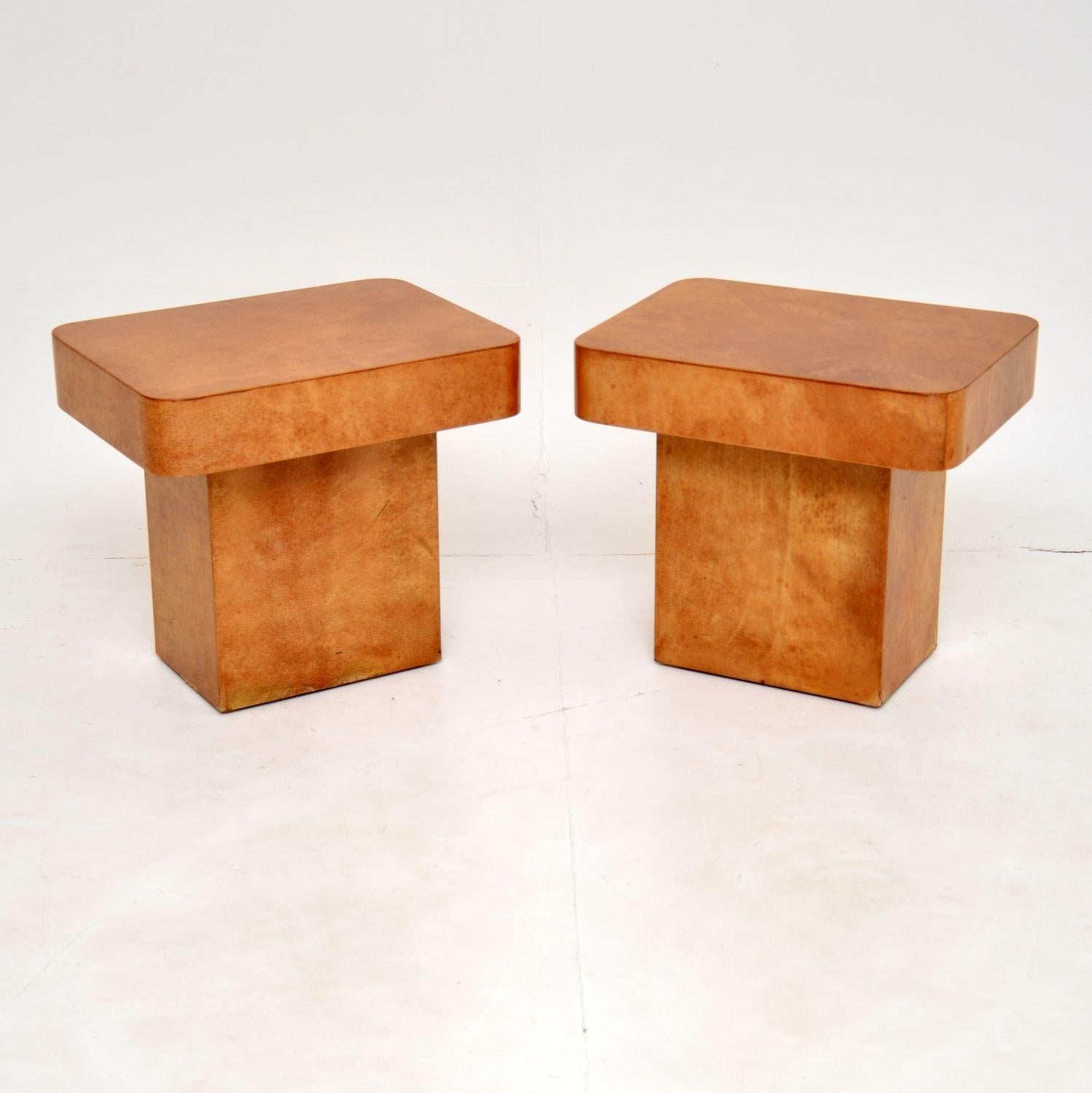 A stunning pair of vintage Italian side tables, made from lacquered goatskin parchment. These were designed by Aldo Tura, they were made in Italy around the 1970’s.

The quality is outstanding, these are a useful and petite size. They have a
