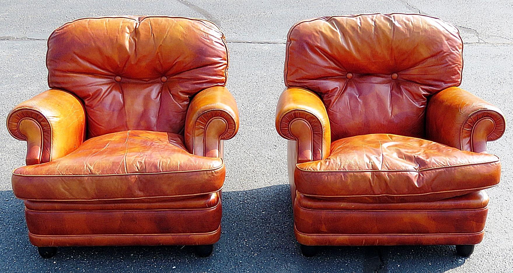 Pair of Italian Mid-Century Modern distressed leather club chairs.