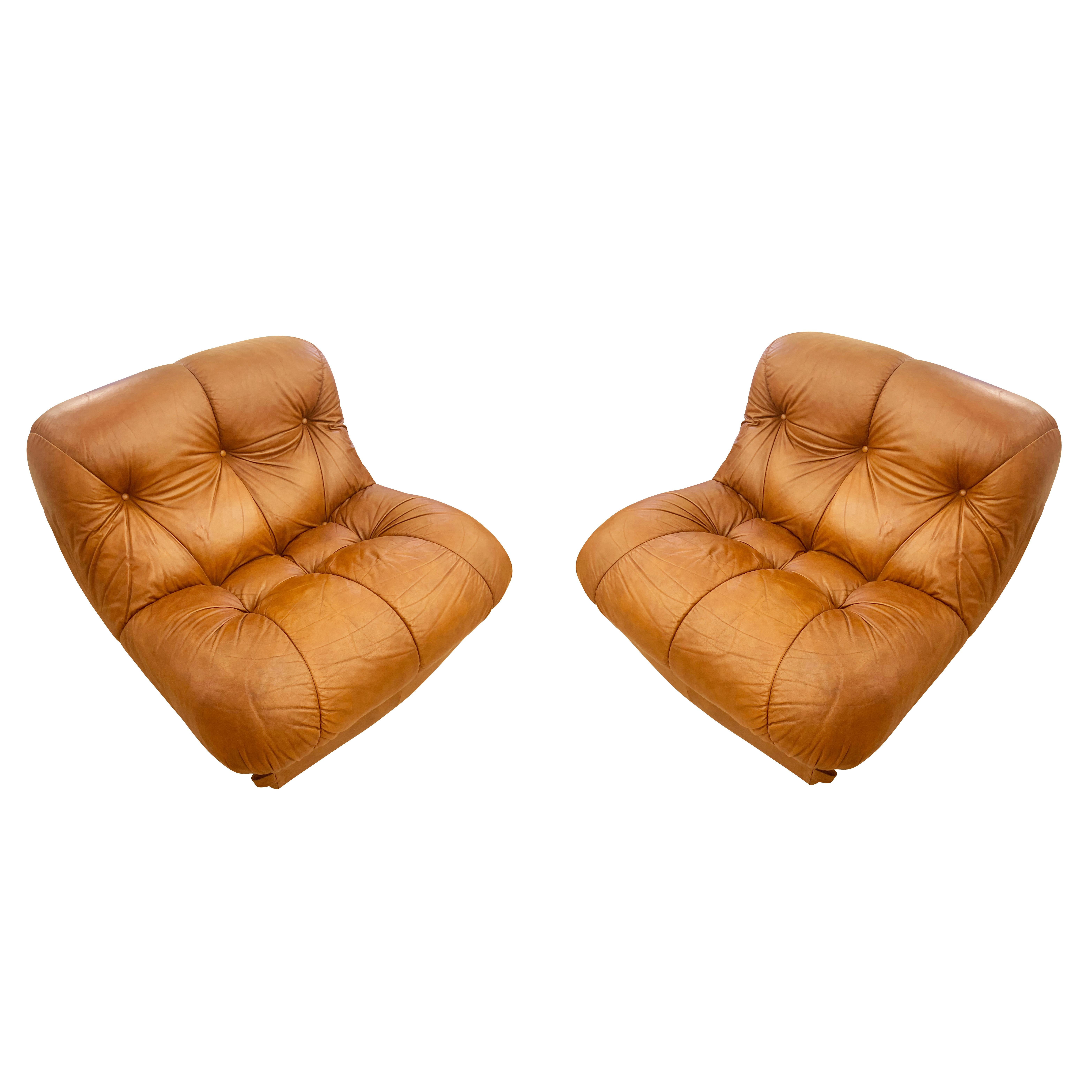 Pair of Italian Mid-Century lounge chairs with their original leather. Can be sold individually on request.

Condition: Good original condition, wear consistent with age and use.

Width: 35”

Depth: 36”

Height: 27”

Seat Height:  15”