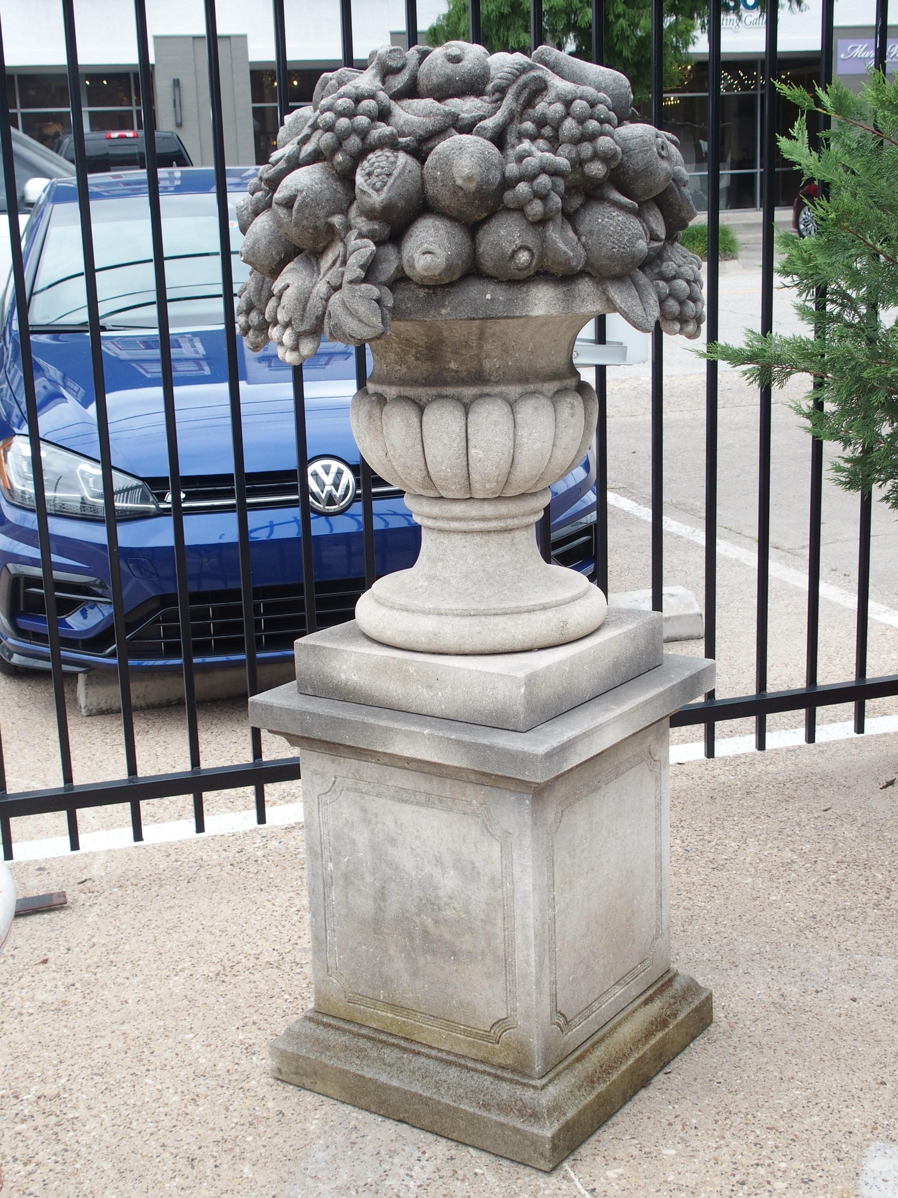 Contemporary Pair of Italian Limestone Urns with Fruit and Floral Bouquets on Pedestals