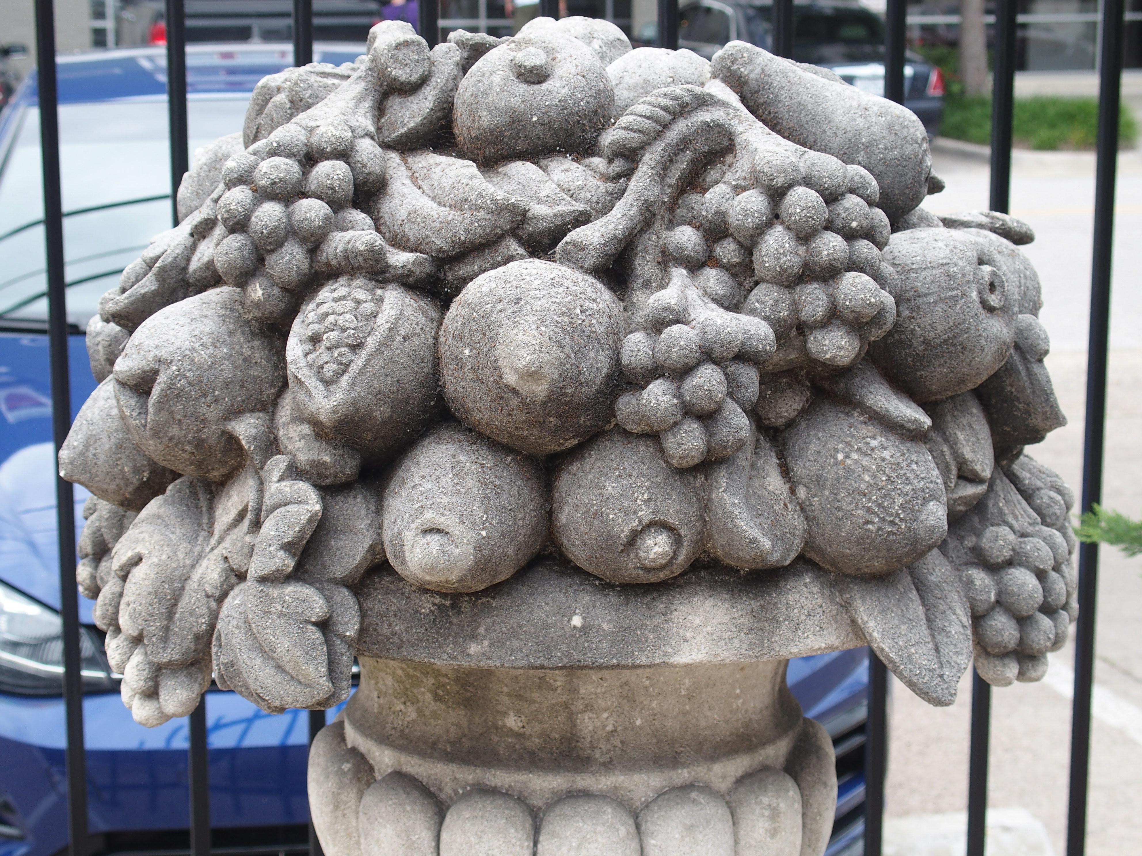 Pair of Italian Limestone Urns with Fruit and Floral Bouquets on Pedestals 1