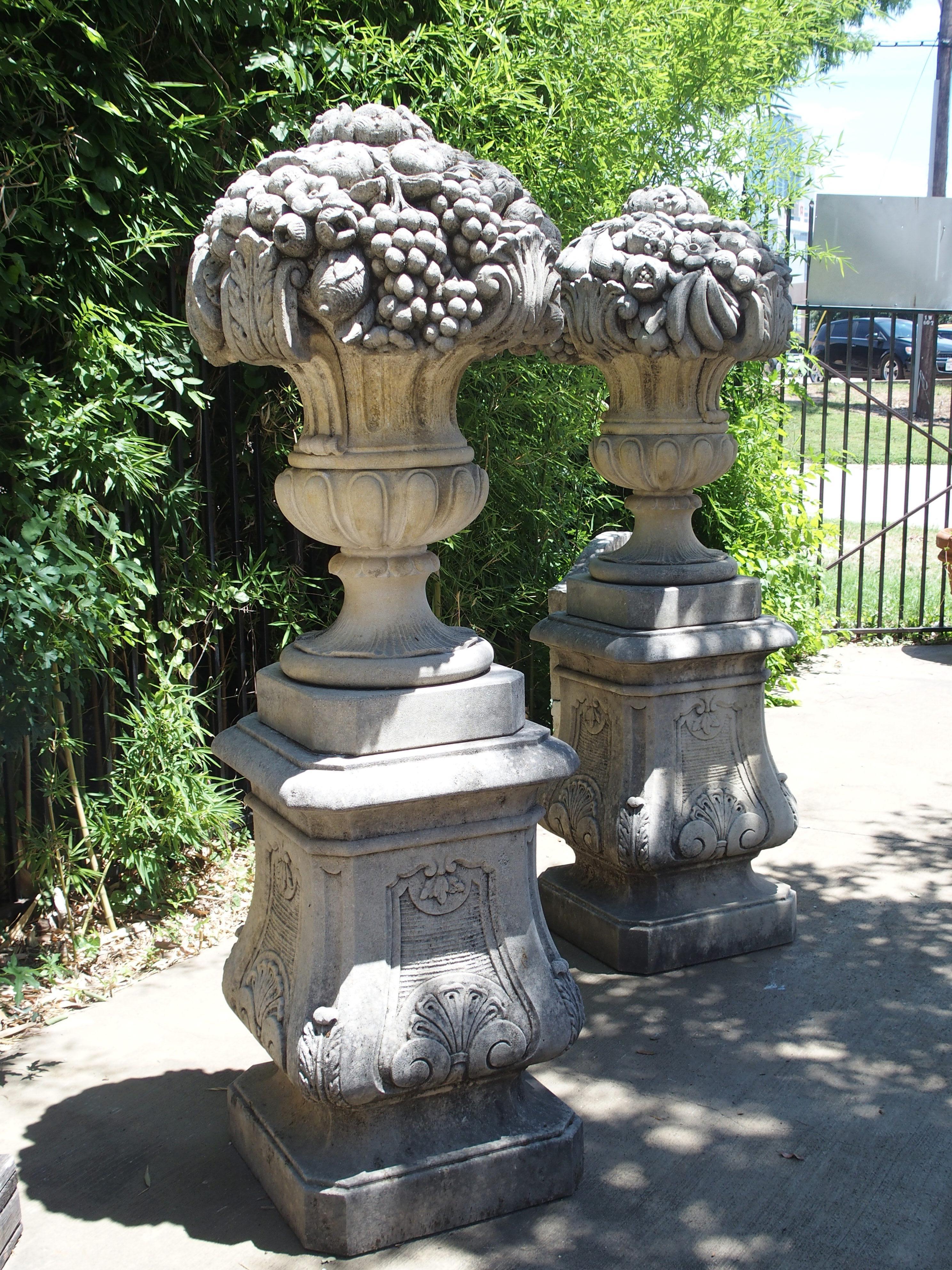 Pair of Italian Limestone Urns with Fruit and Floral Bouquets on Pedestals 2