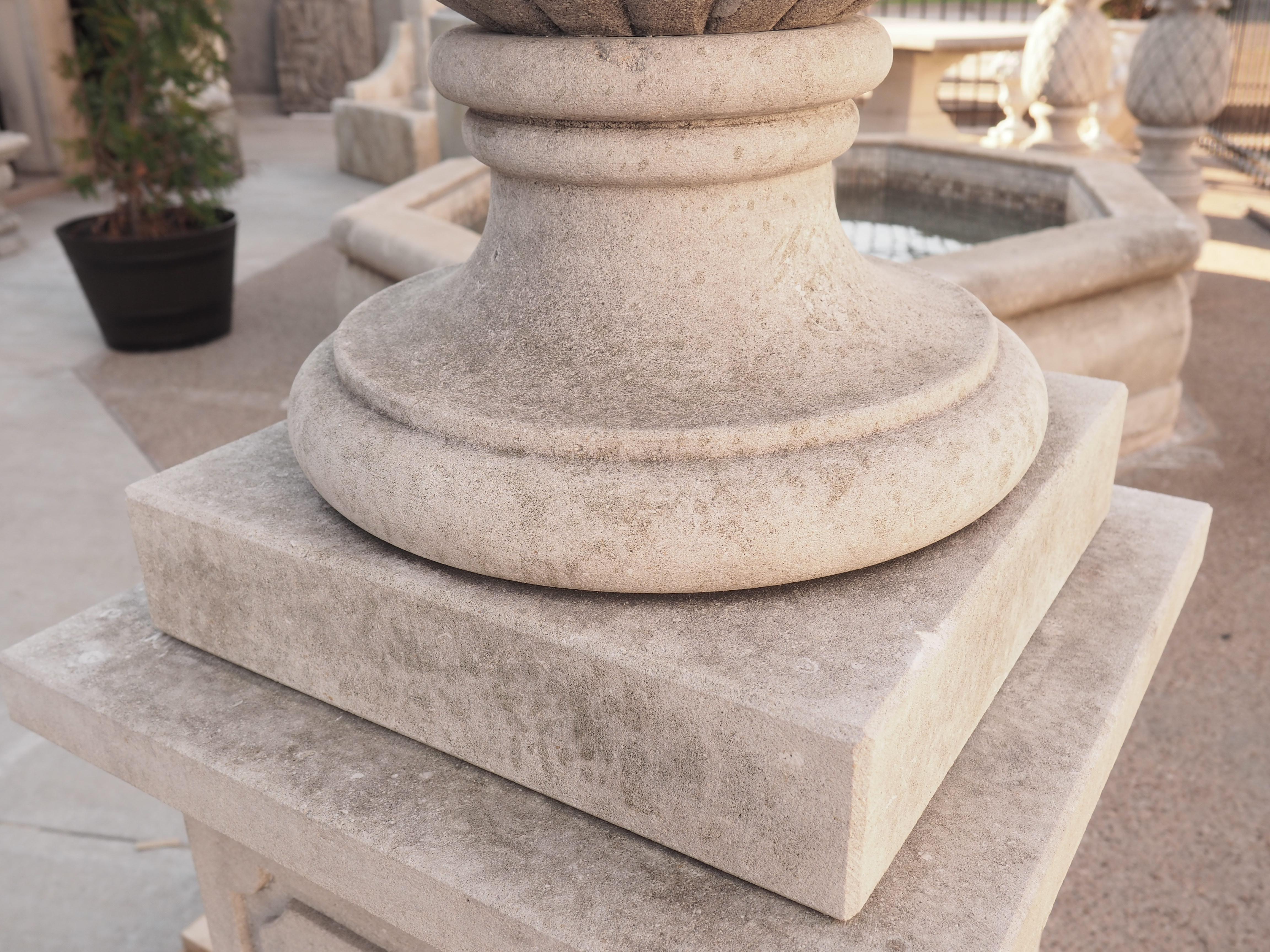 Pair of Italian Limestone Urns with Fruit and Floral Bouquets on Pedestals For Sale 2