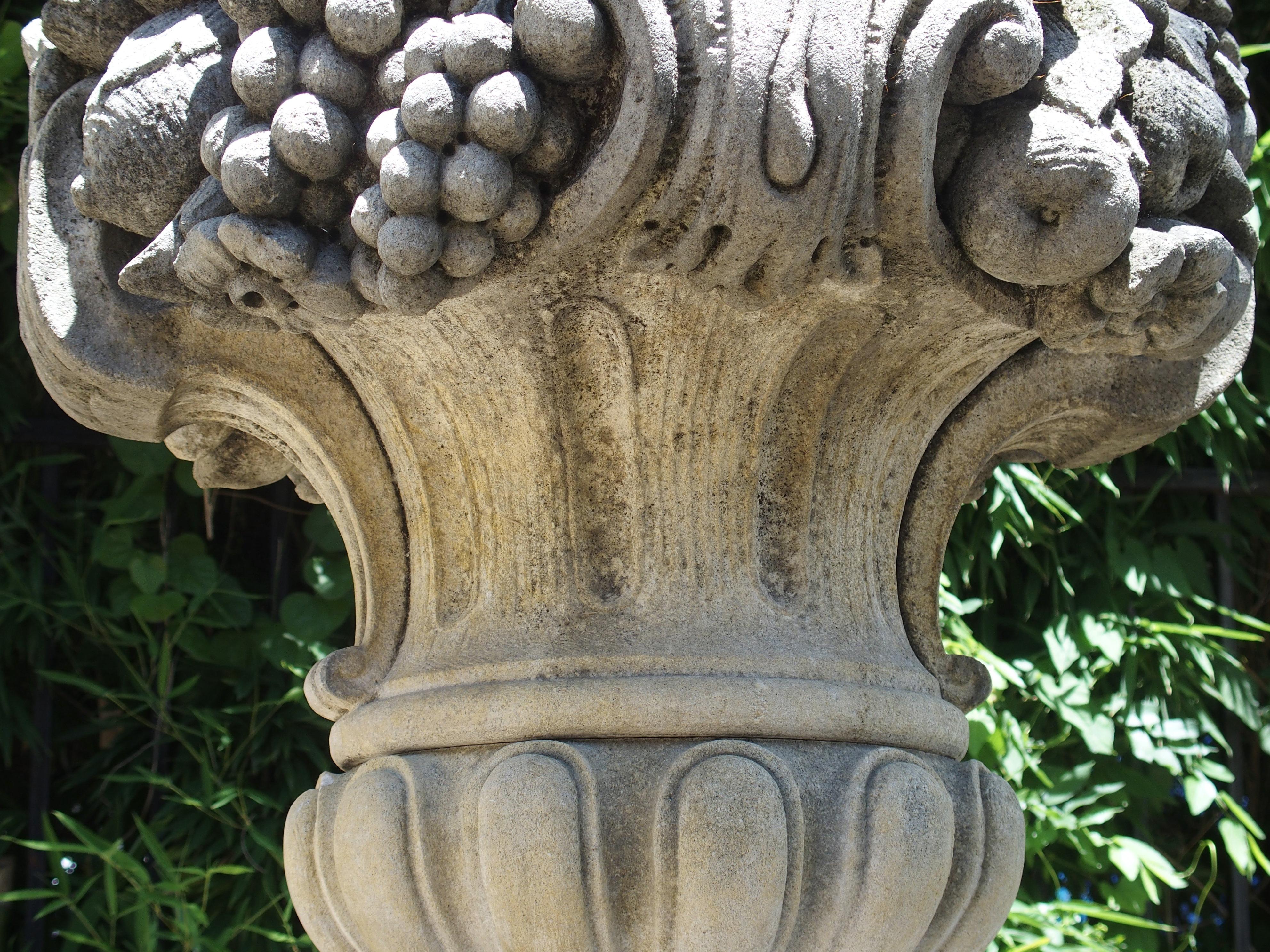 Pair of Italian Limestone Urns with Fruit and Floral Bouquets on Pedestals 4