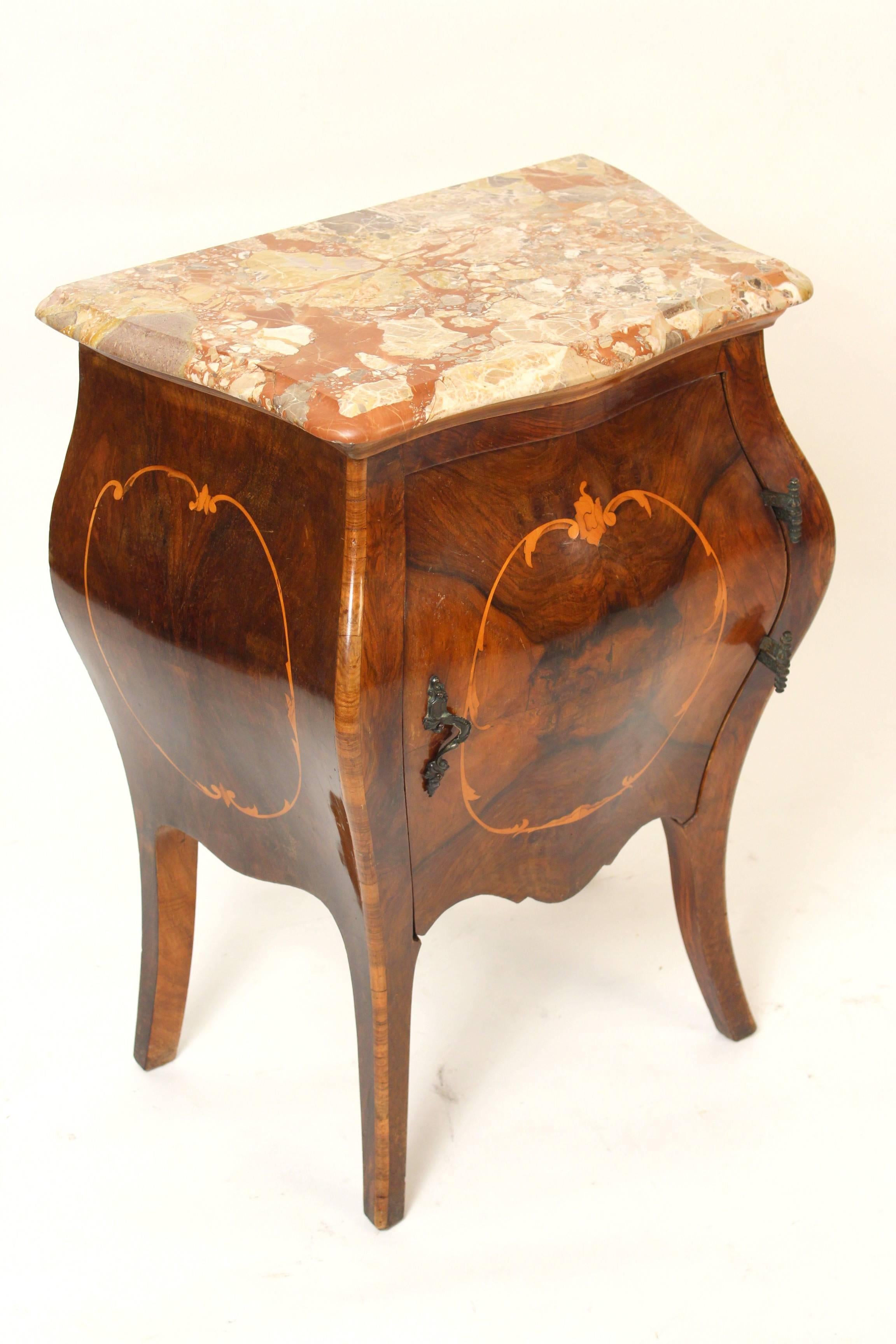 Pair of Italian Louis XV style burl walnut inlaid bombe occasional commodes with marble tops, circa 1930s.