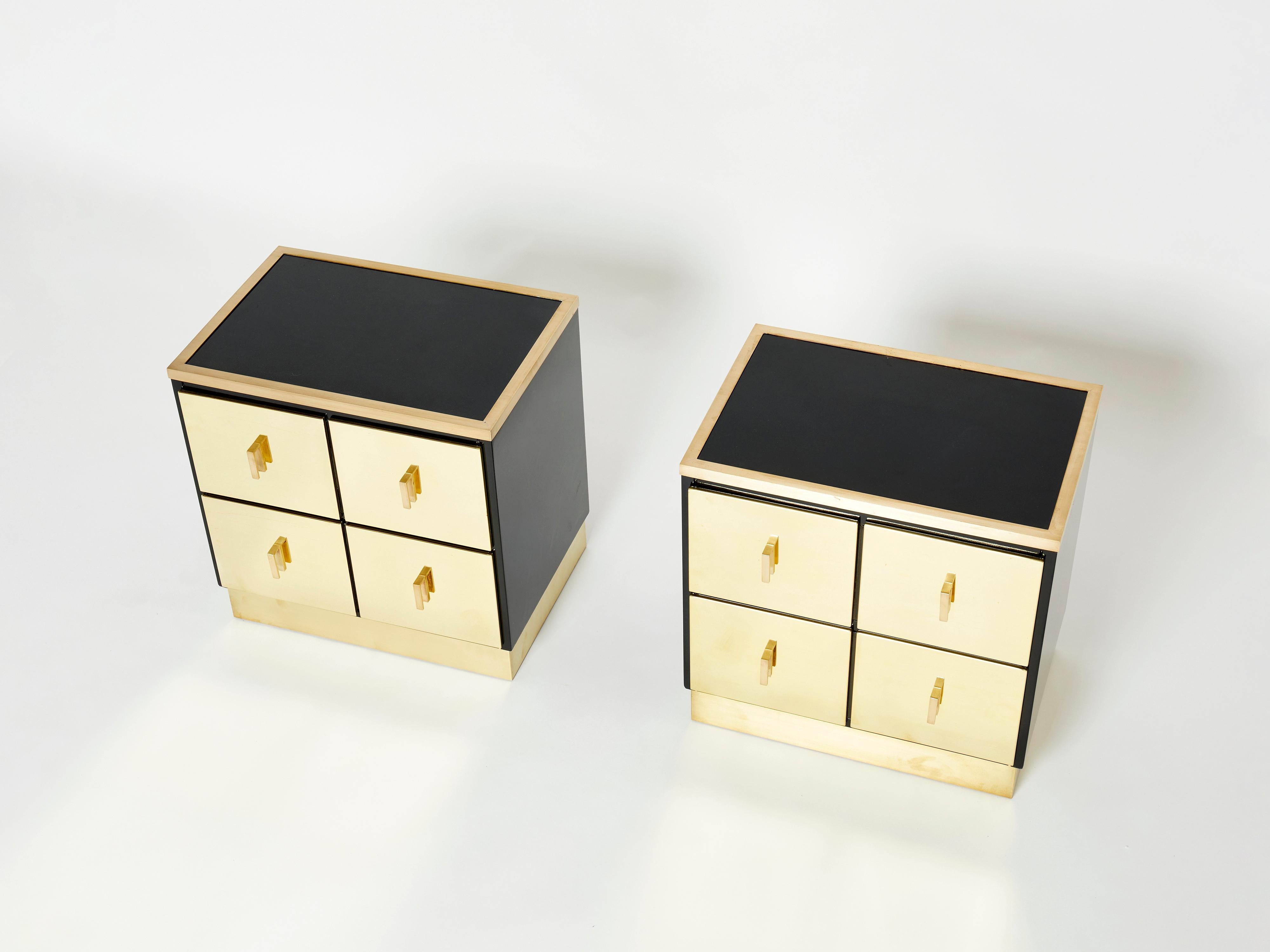 This rare pair of Italian mid-century two drawers black lacquered nightstands or end tables would be stunning in any room. Designed by Luciano Frigerio for Frigerio Di Desio in Italy in the early 1970s, the shiny black lacquer paired with the mix of