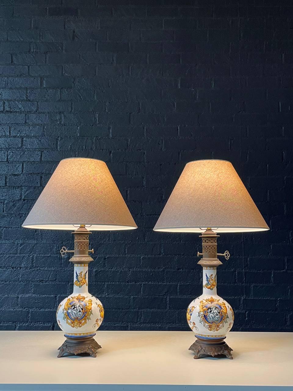 Condition: Newly Rewired, New Shades 

Materials: Hand-Painted Ceramic (Majolica), Metal Bronze-Finish Bases, New Shades
Style: Neo-Renaissance 

This striking pair of Italian table lamps features hand-painted Majolica ceramic bases adorned with
