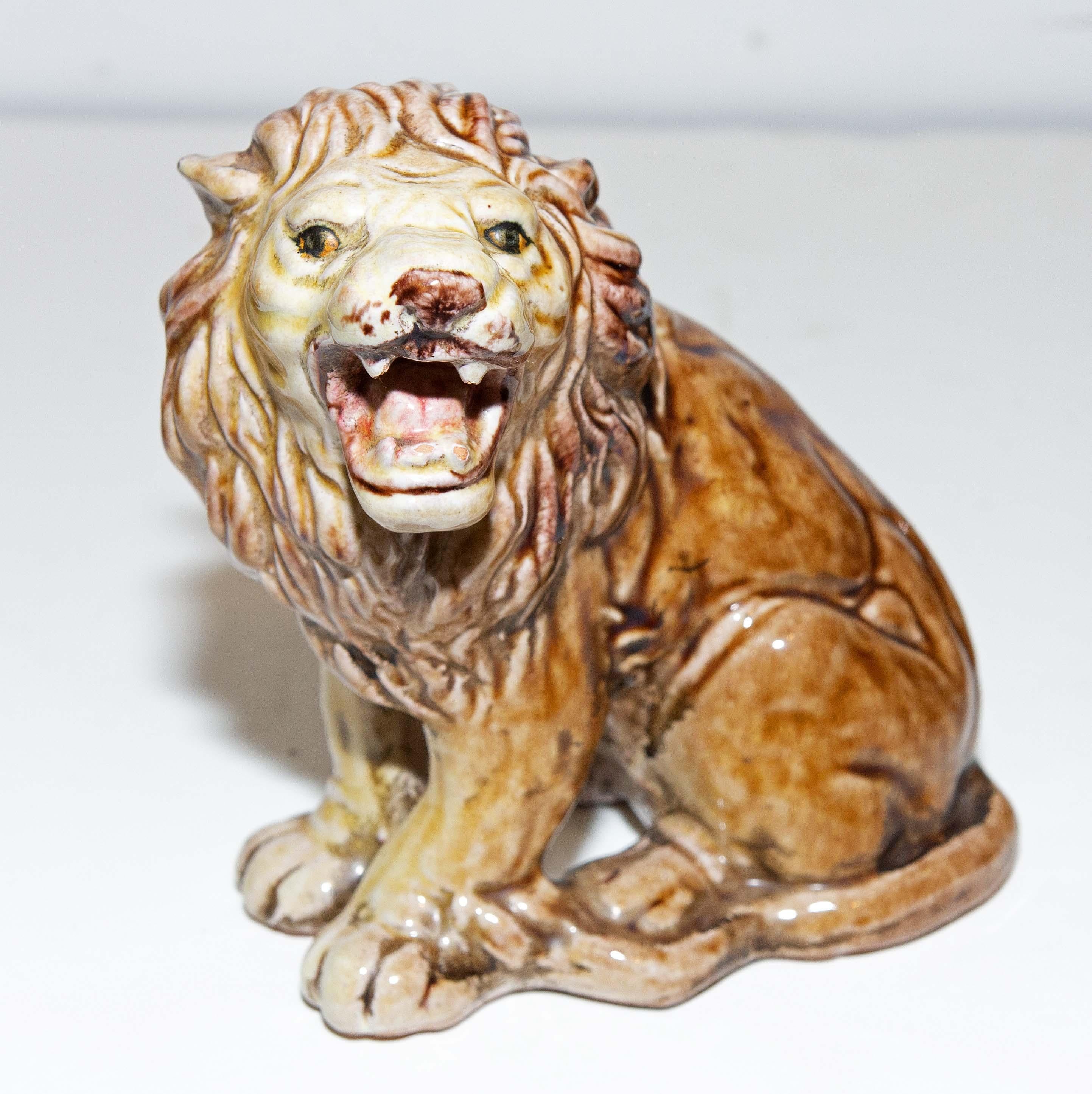 Early 20th century Italian Majolica lions. Well made with great character.