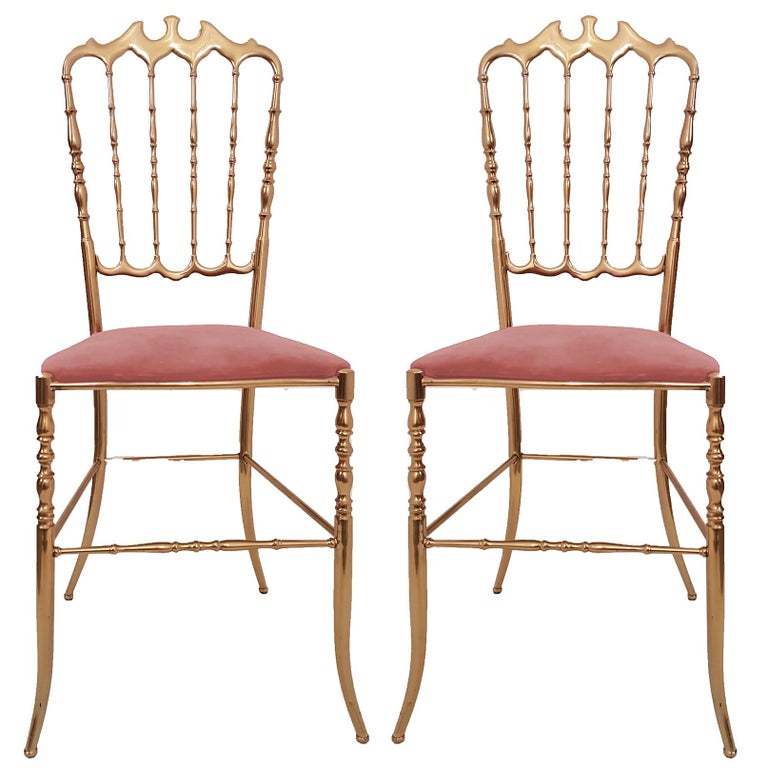 Pair of refined Italian campanino classic Chiavari chairs, circa 1950s. Massive brass with upholstered with pink velvet.

In very good condition. We are able, to reupholster these chairs in any type of fabric. The professional and experienced