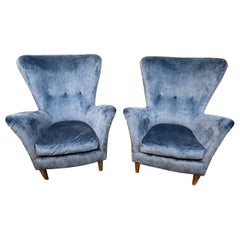 Coppia di poltrone club imbottite in velluto MCM italiane