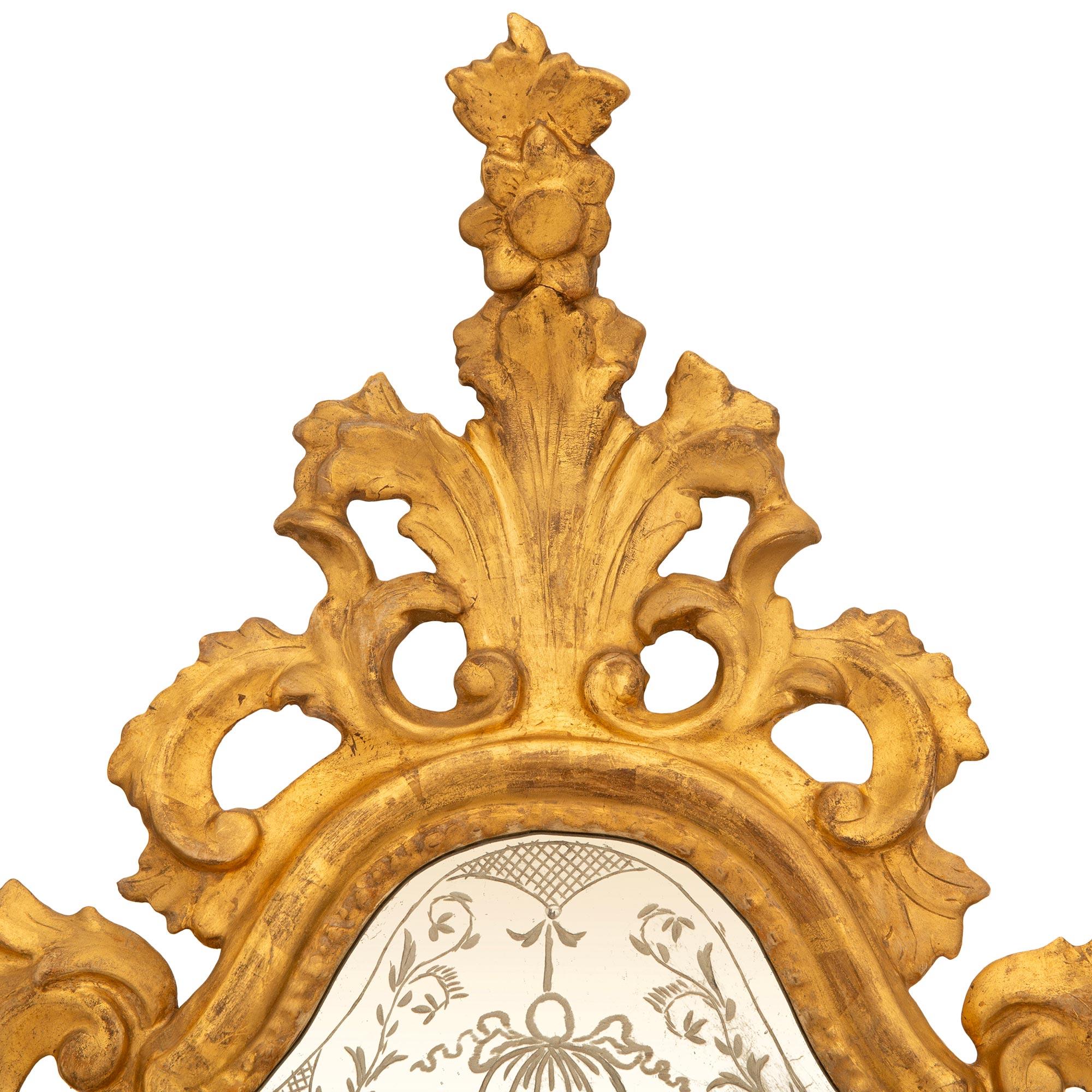 Mirror pair of Italian mid 18th century Baroque Period Giltwood mirrored sconces For Sale