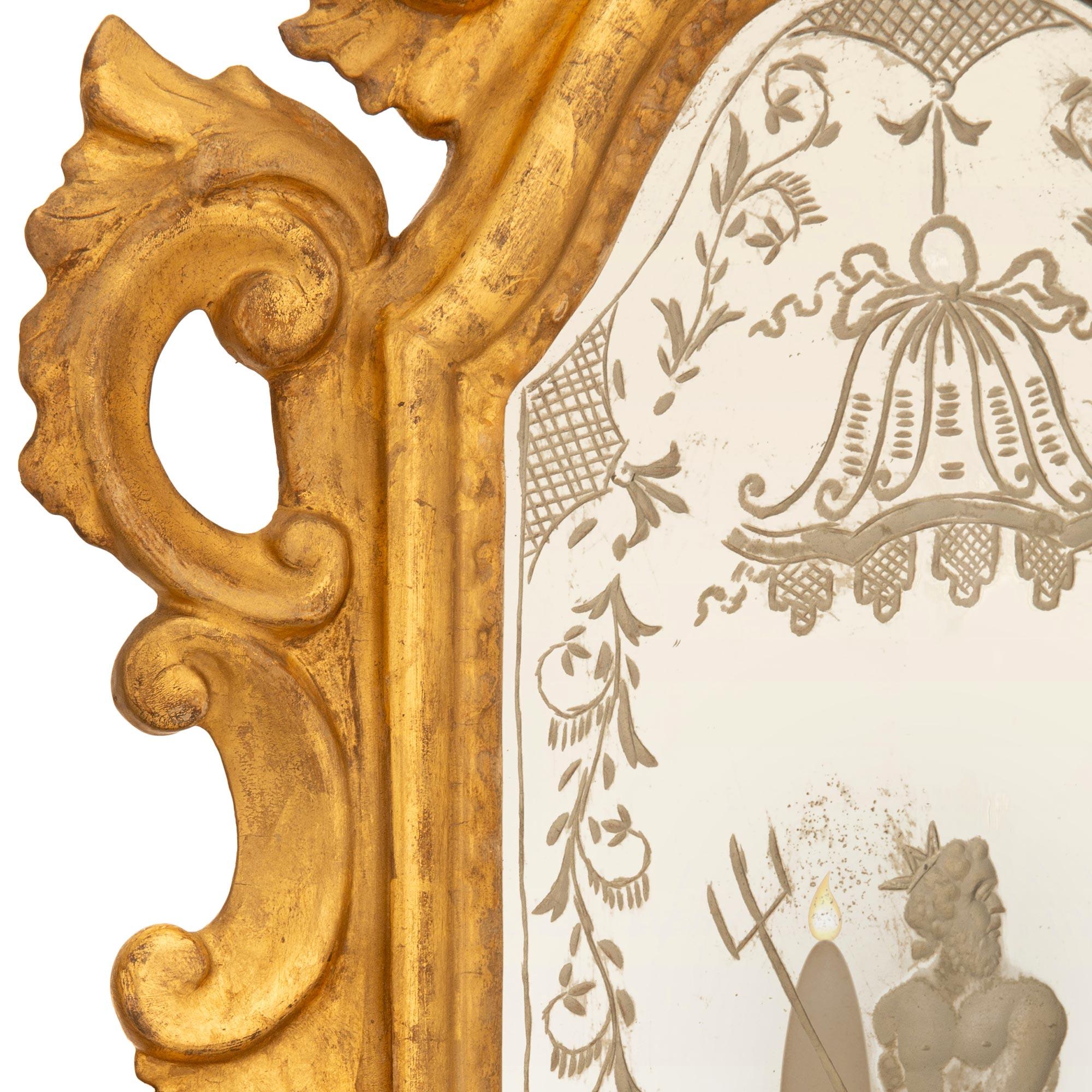 pair of Italian mid 18th century Baroque Period Giltwood mirrored sconces For Sale 1
