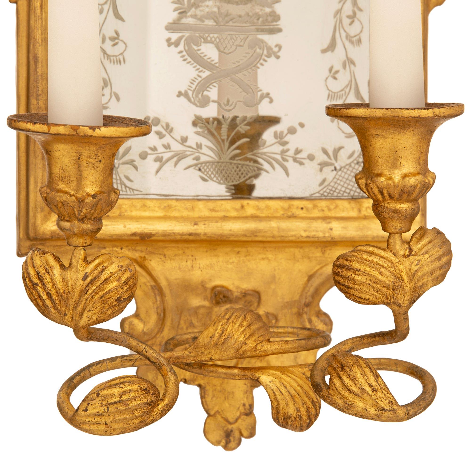 pair of Italian mid 18th century Baroque Period Giltwood mirrored sconces For Sale 4