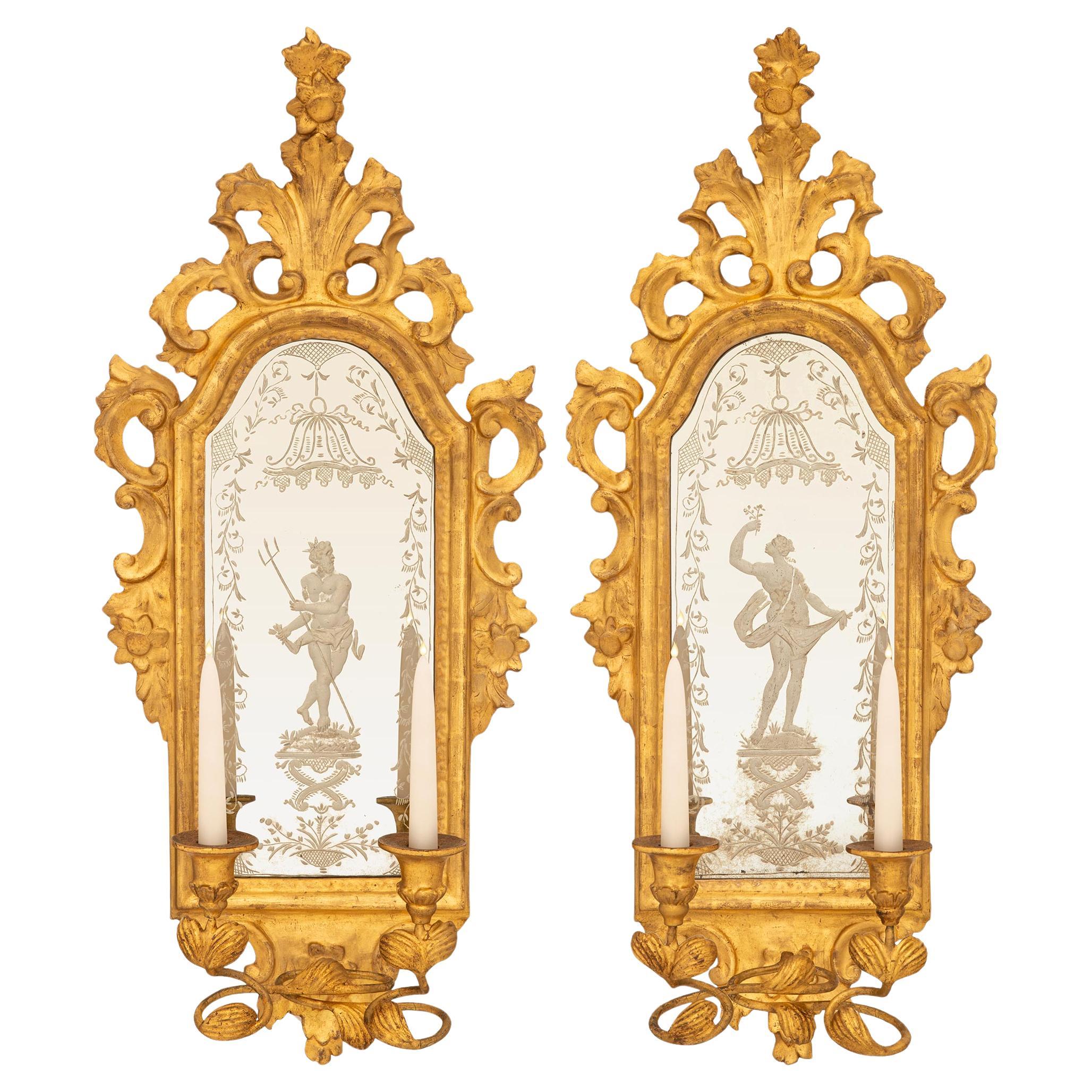 pair of Italian mid 18th century Baroque Period Giltwood mirrored sconces For Sale
