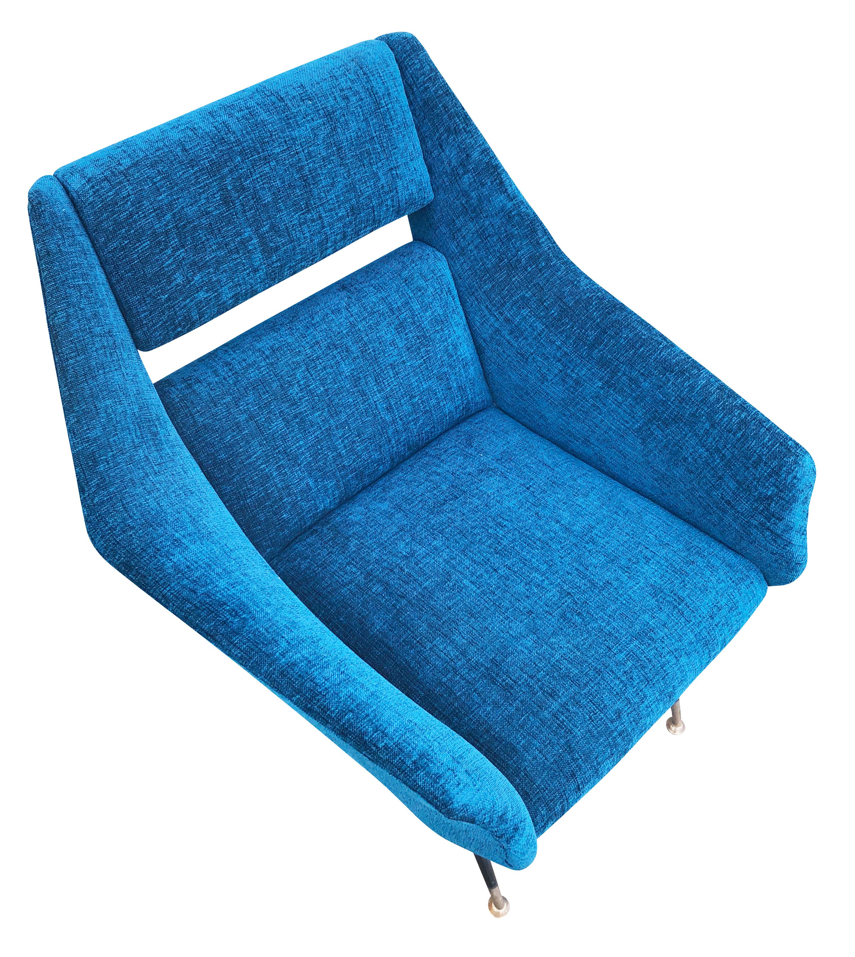 Pair of midcentury lounge chairs by Gigi Radice for Minotti. An iconic design with the very recognizable slit back and brass lags. Recovered in a blue fabric. Price listed is for the pair-Can be split upon request. 

Condition: Minor wear