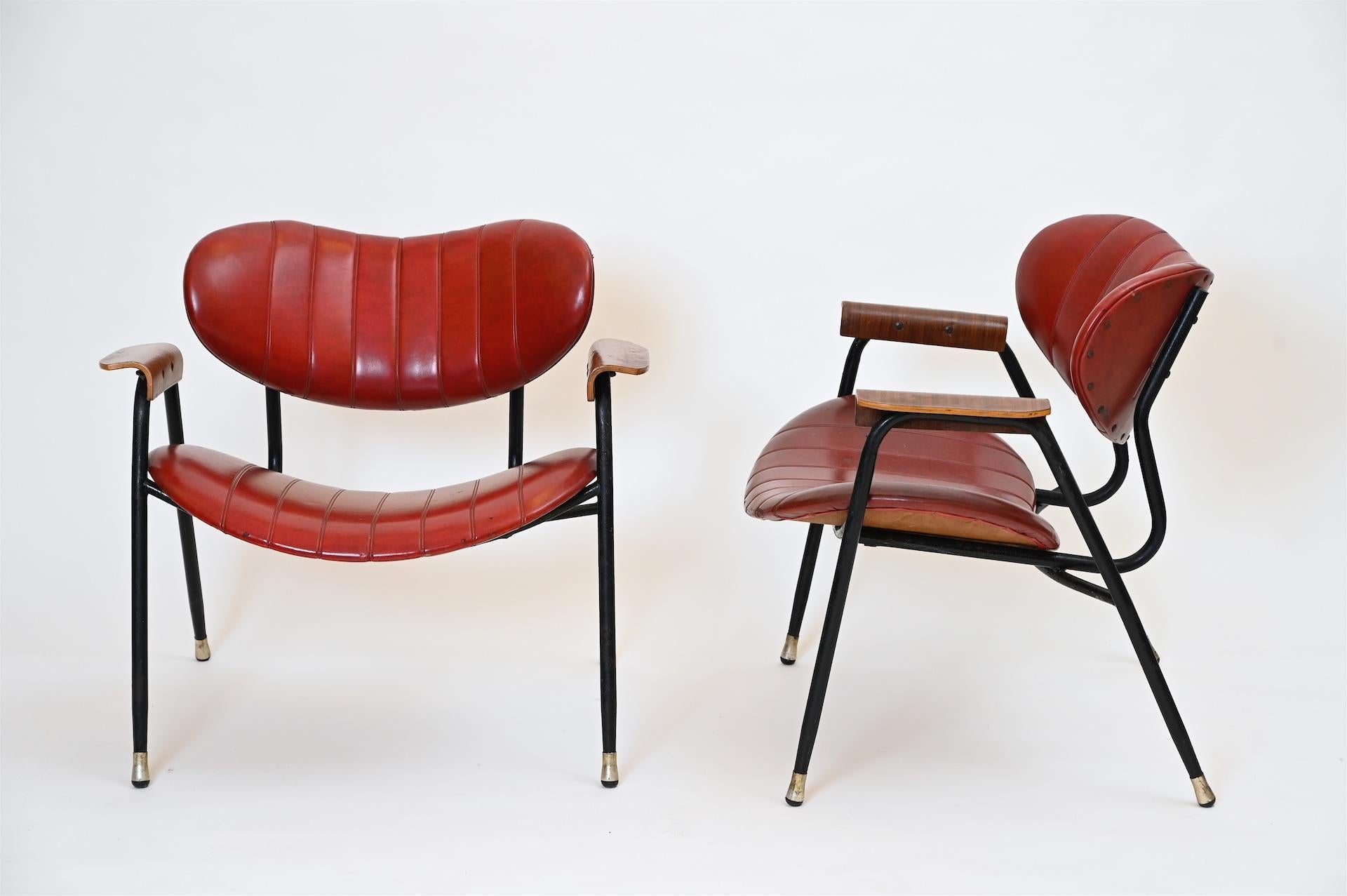 Unrestored midcentury Italian armchairs with original red upholstery.

Actually very comfortable chairs!