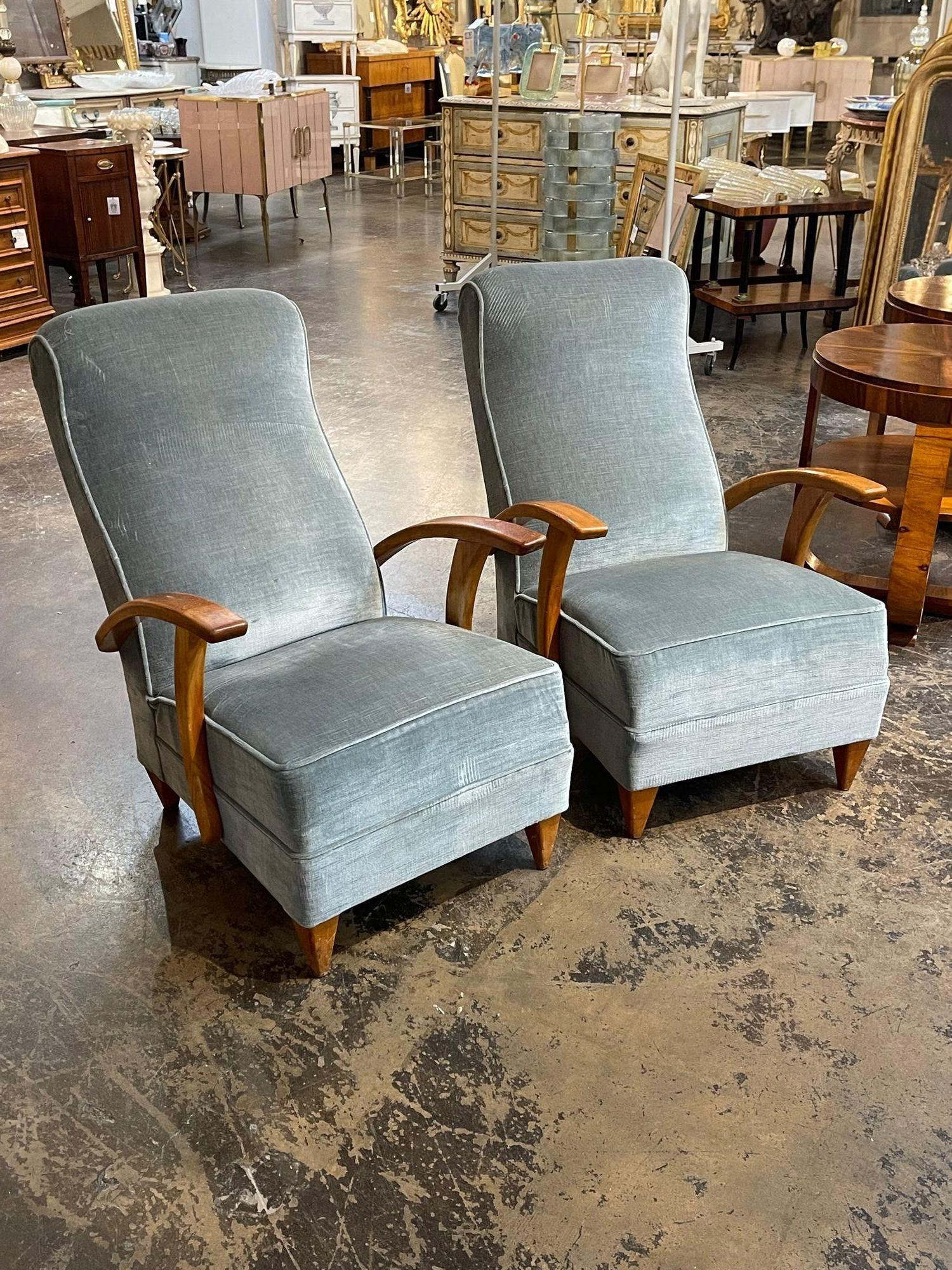 Nice pair of Italian mid-century designer armchairs with blue velvet. Circa 1960. Perfect for today's transitional designs!