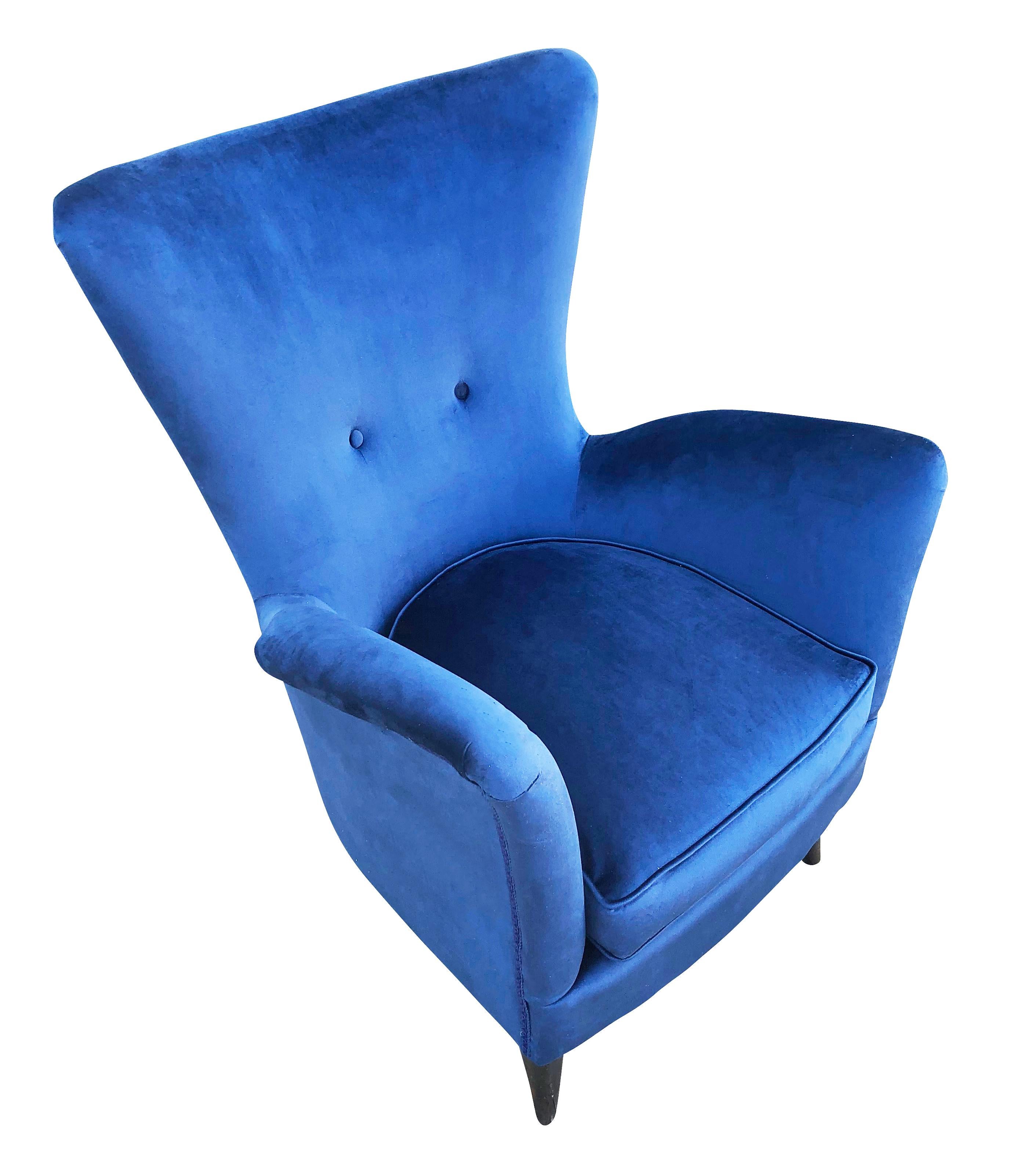 High back Italian midcentury lounge chairs in the manner of Ico Parisi. Recovered in a dark blue velvet. Price listed is for the pair but they can be split upon request.

Condition: Minor wear consistent with age and use. Recently