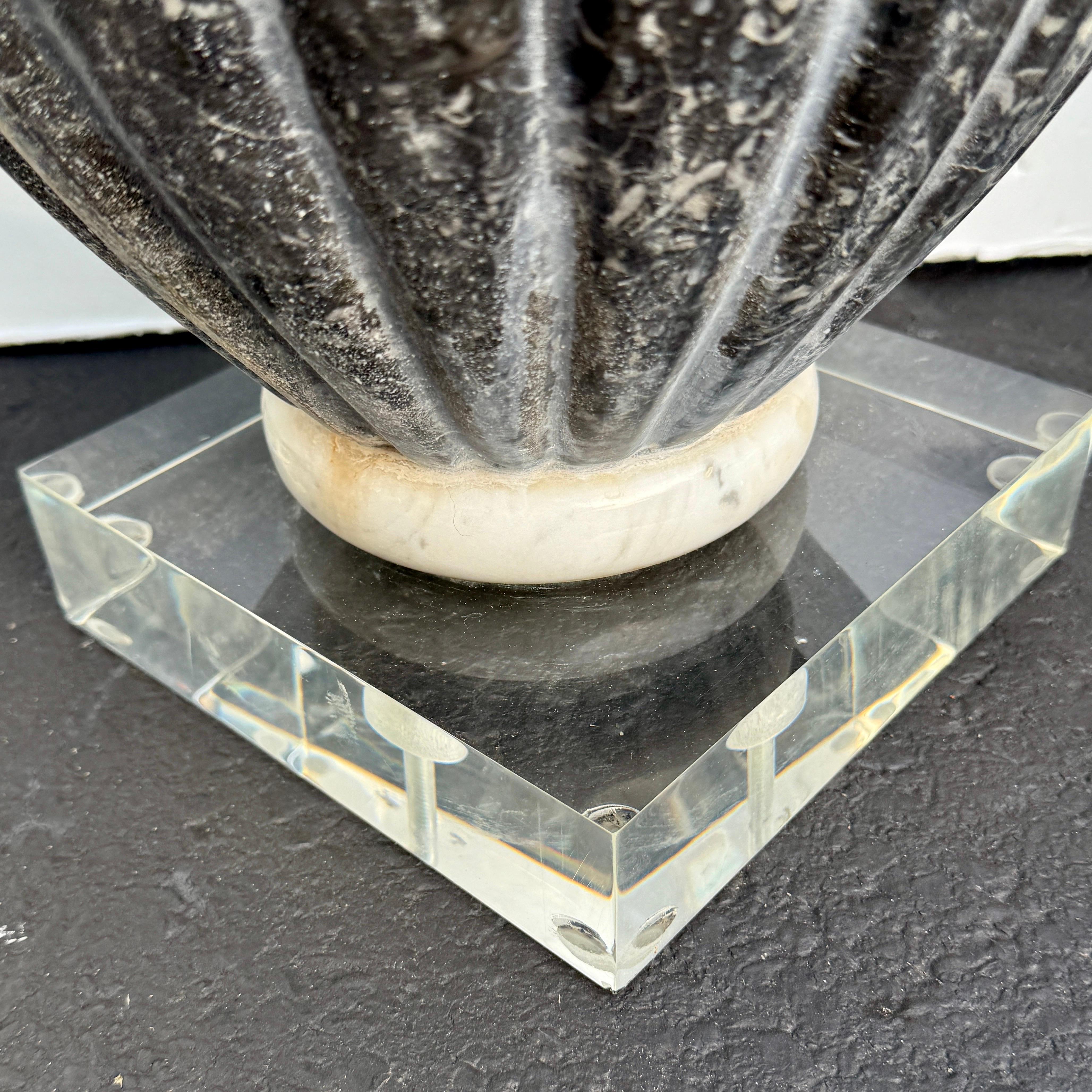 Italian marble planters with fluting and bronze hardware. Perfect pieces for indoor or outdoor. Certainly, would make a fantastic statement framing an entrance or displayed in a garden patio. This pair has been mounted on later 2