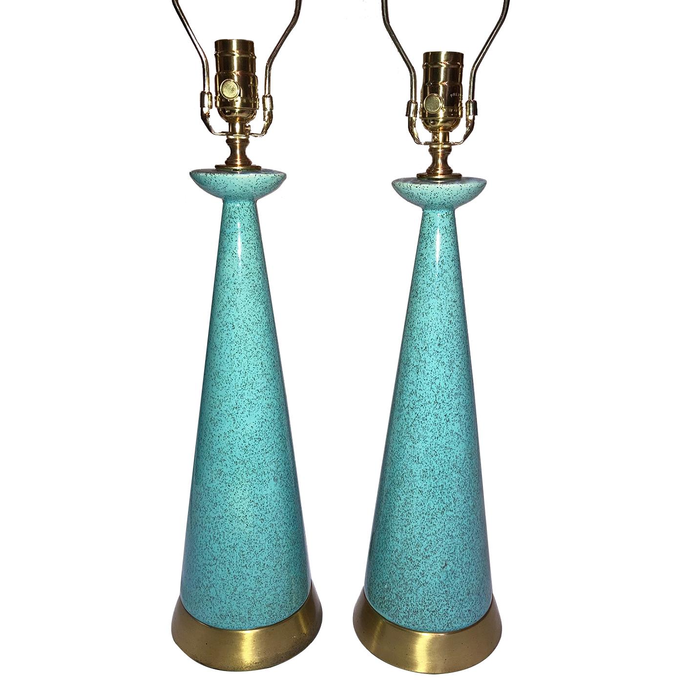 A pair of circa 1960's Italian glazed blue ceramic table lamps with gilt brass bases.

Measurements:
Height of body: 19