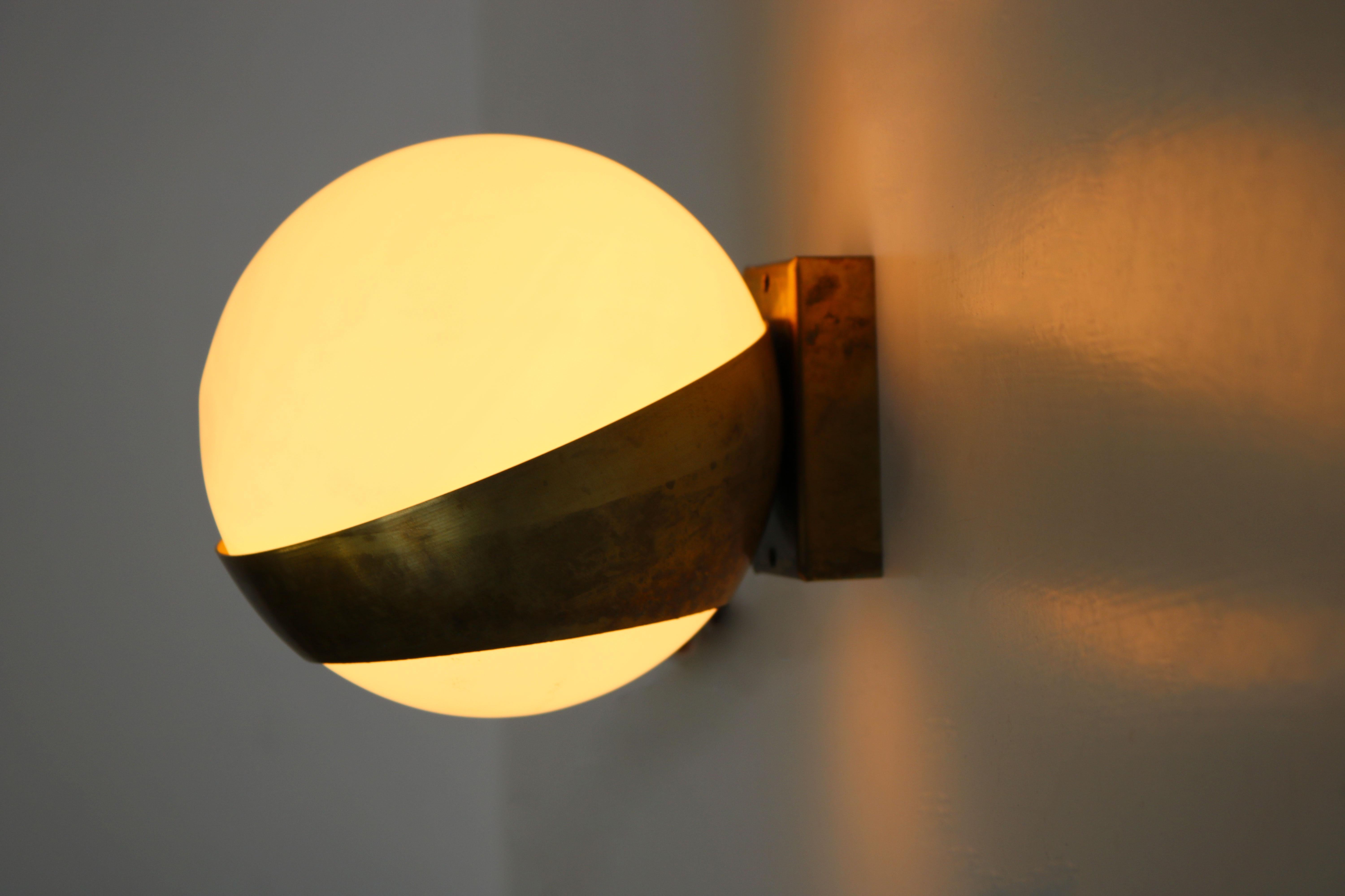 Stylish & timeless ! These Italian 1950 mid-century design wall lights in the style of Stilnovo 
Marvelous combination between brass & opaline glass ! 
These wall lights look amazing when lit and are a superb example of the famous Italian design