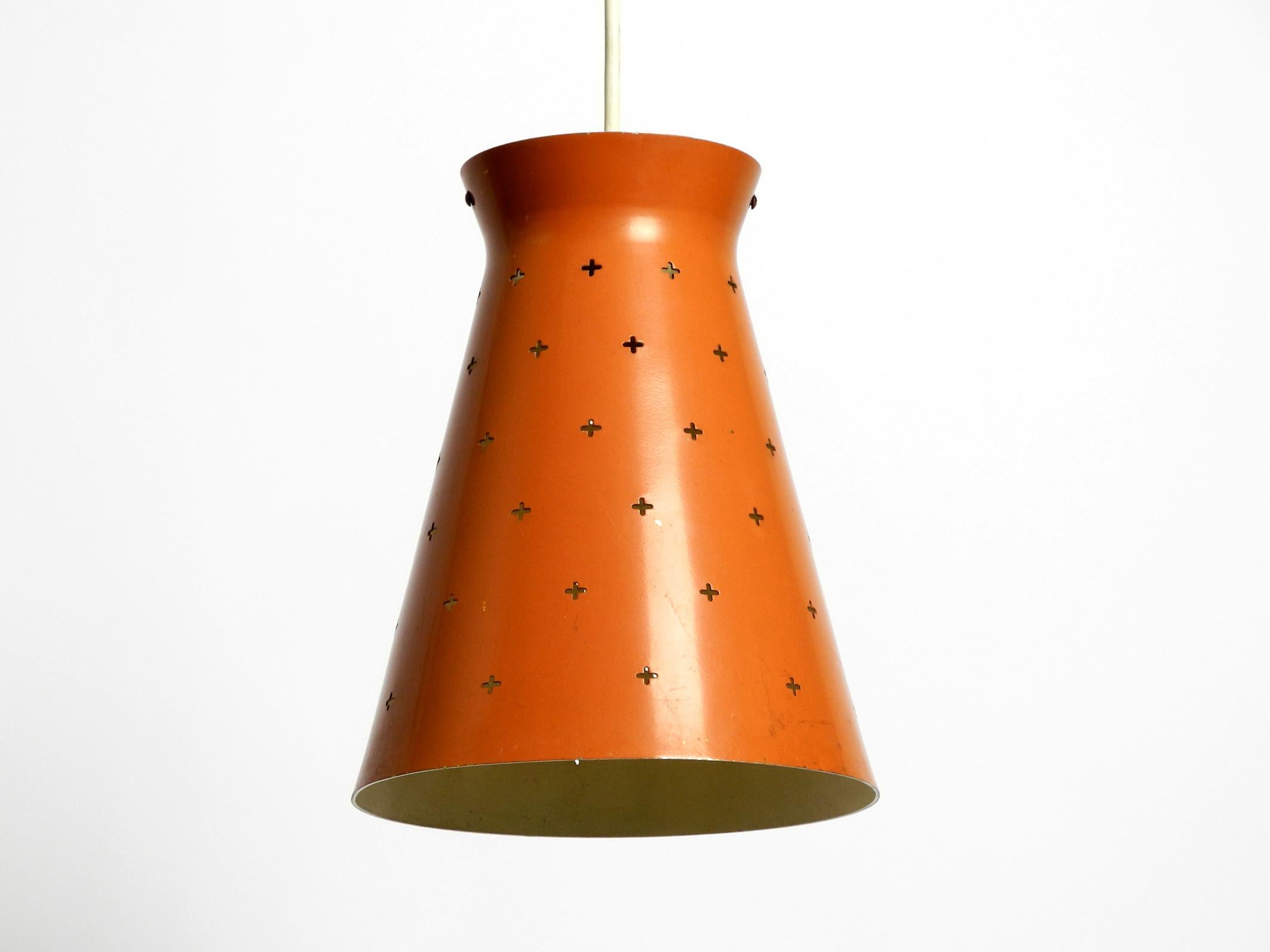 Pair of Italian Mid Century Diabolo design perforated sheet metal pendant lamps In Good Condition For Sale In München, DE