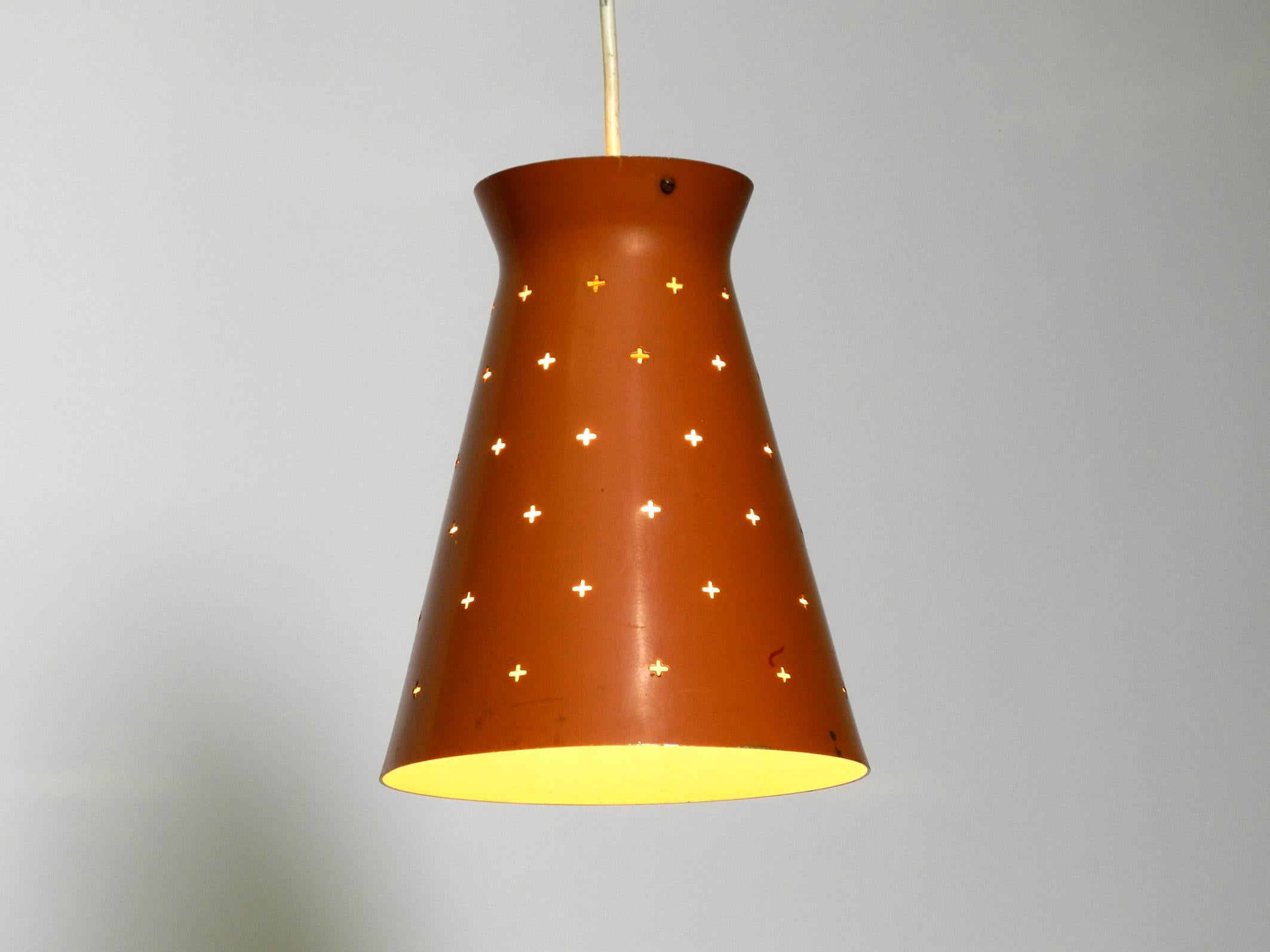 Mid-20th Century Pair of Italian Mid Century Diabolo design perforated sheet metal pendant lamps For Sale