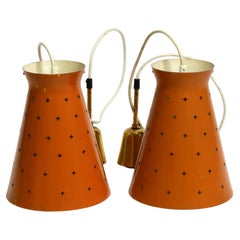 Pair of Italian Mid Century Diabolo design perforated sheet metal pendant lamps