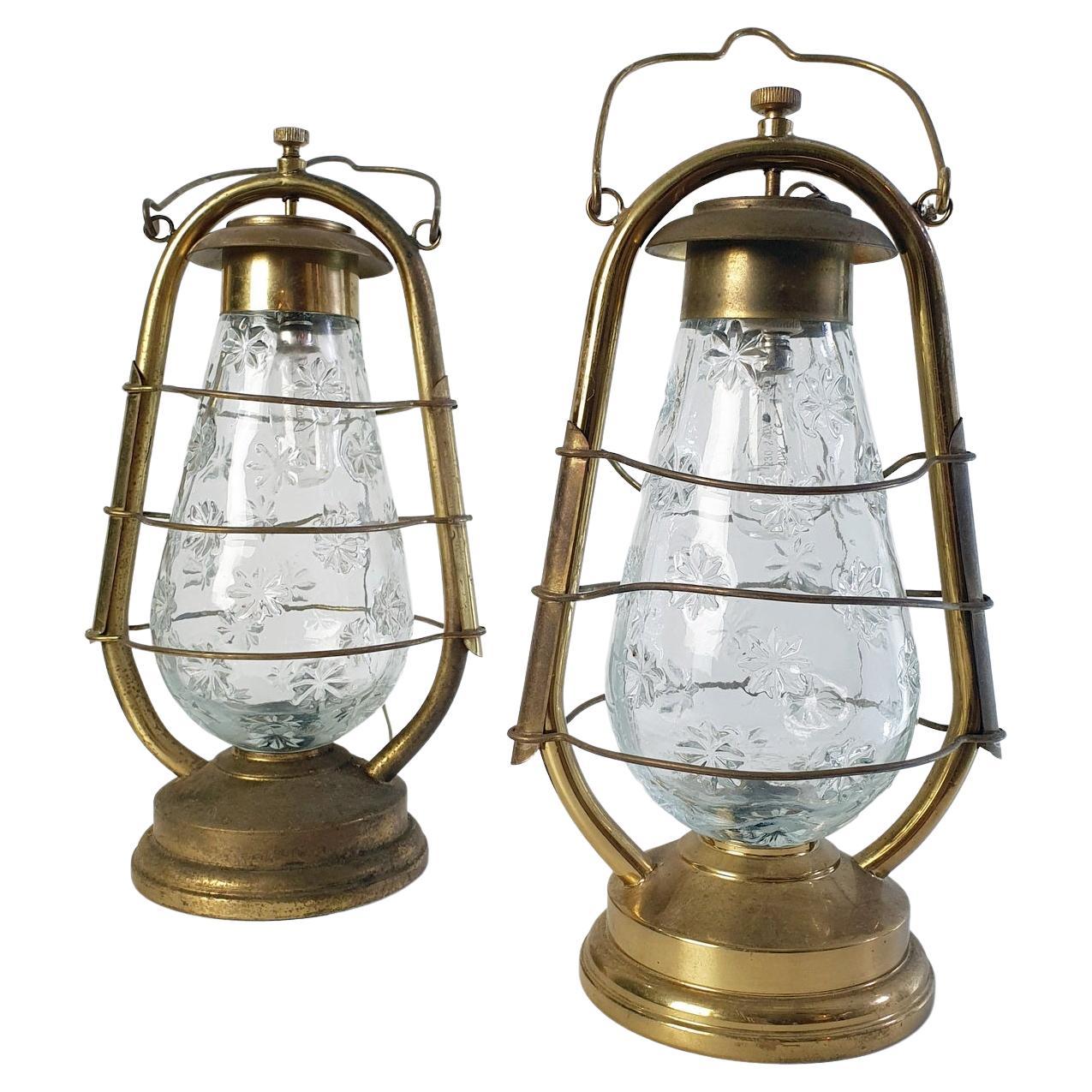 A pair of Italian lamps in the design of hurricane lanterns. The lamps are possible to use on the table or are hung from the wall or ceiling. In perfect working condition. Works with E14 lightbulbs.