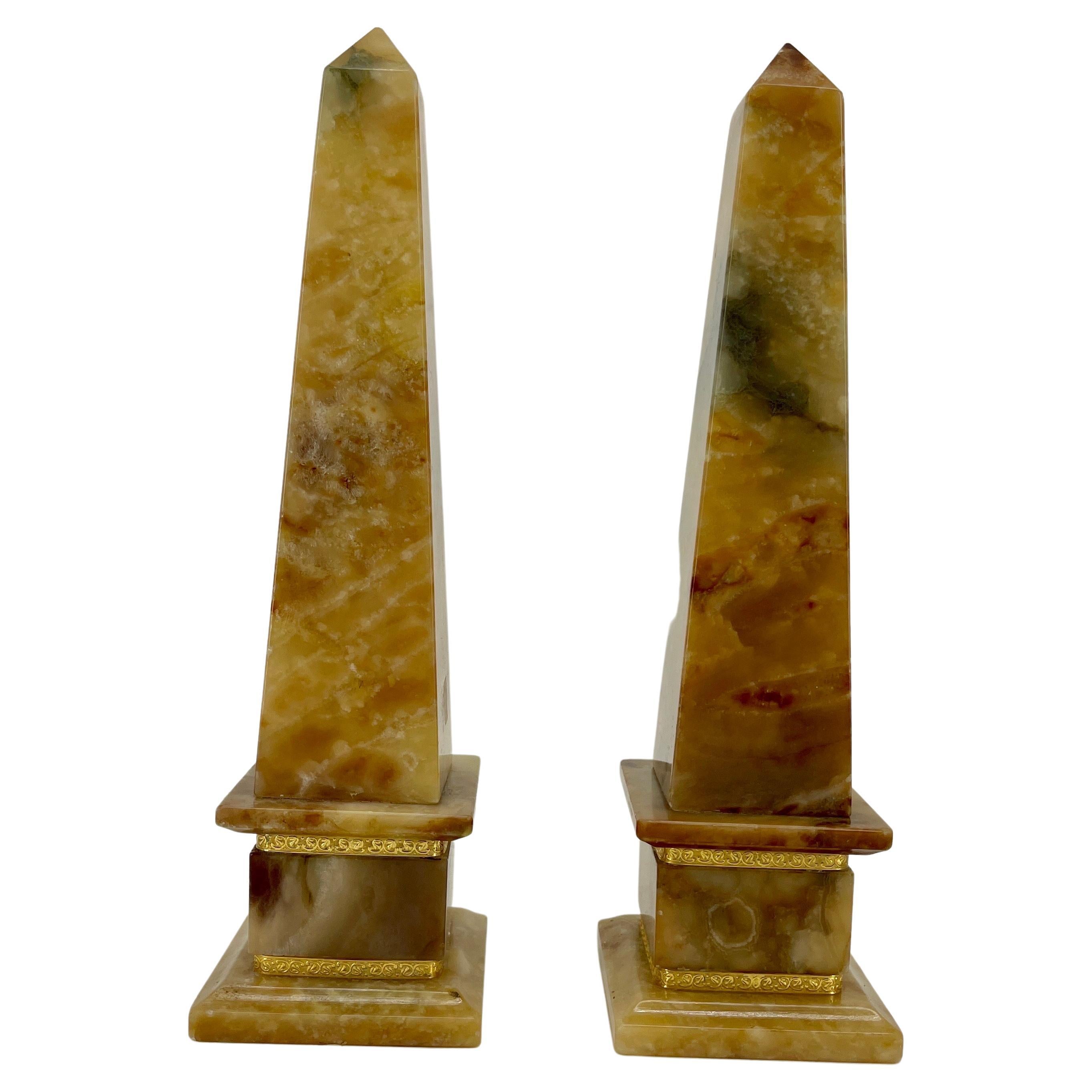 Italian Pair of Hollywood Regency Style Obelisks in Marble with Two Gilded Bands around the Bases, circa 1960s.