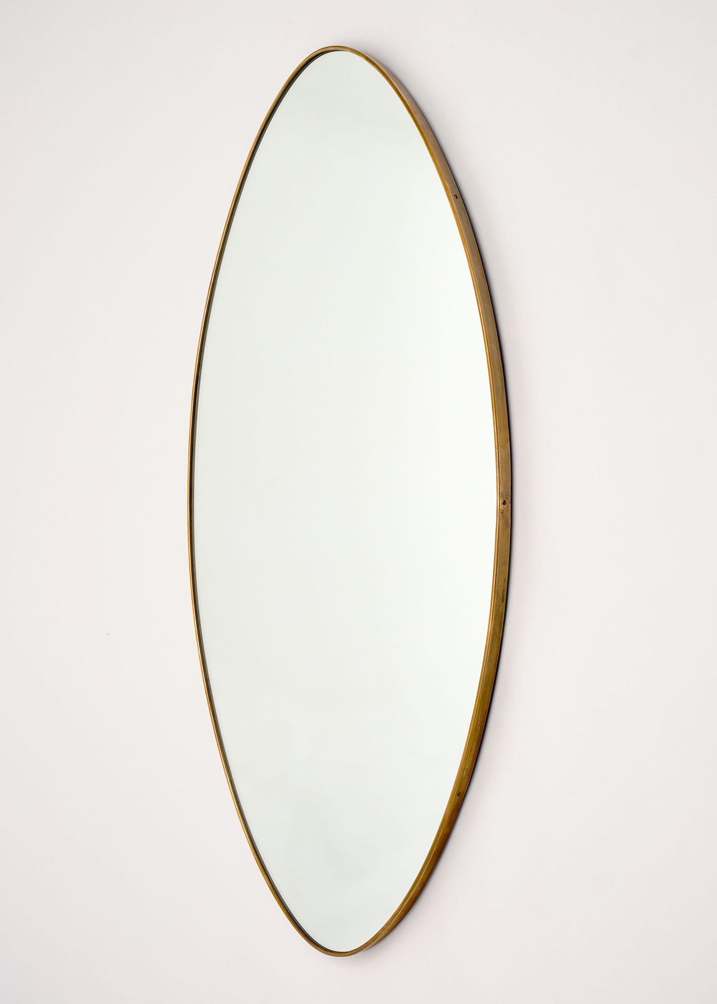 Pair of oval mirrors from Italy. We love this vintage pair in brass frames. They can be sold individually for $4100 each.