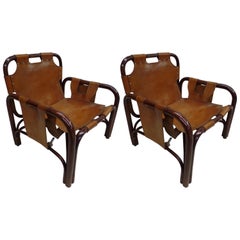 Paire de chaises longues italiennes modernes du milieu du siècle dernier en rotin et cuir par Bonacina
