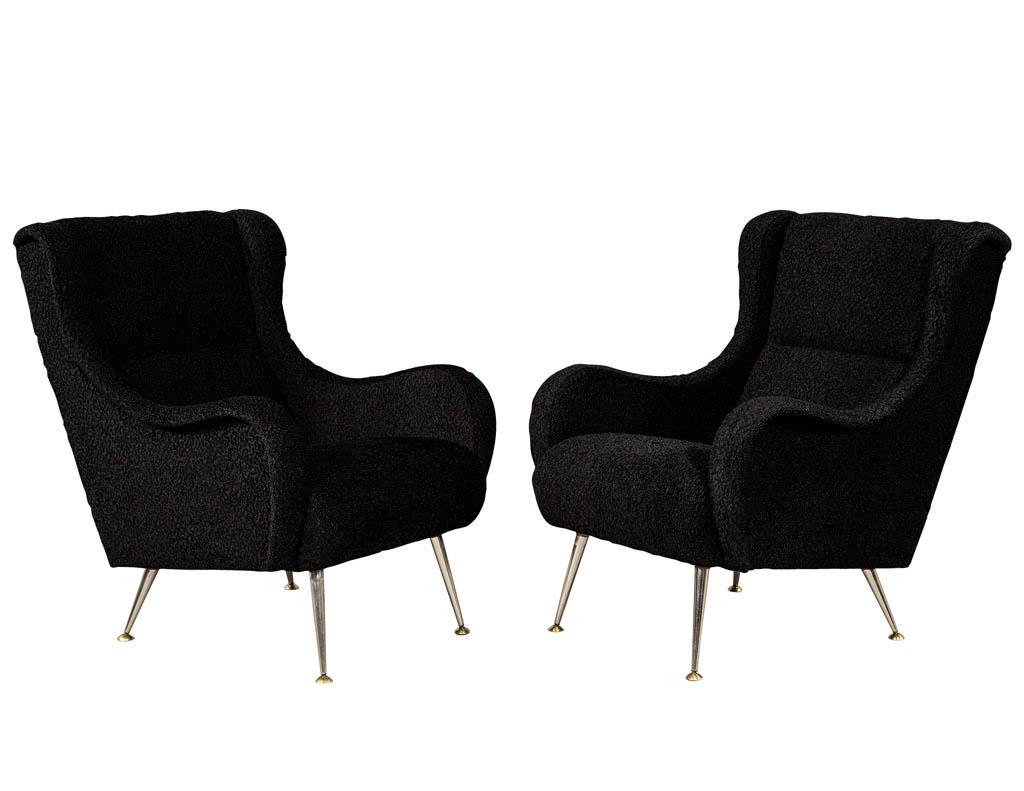 Pair of Italian Mid-Century Modern black lounge chairs in the style of Zanuso. Upholstered in a luxurious black faux sheepskin with original metal bases.
Price includes complimentary curb side delivery to the continental USA.