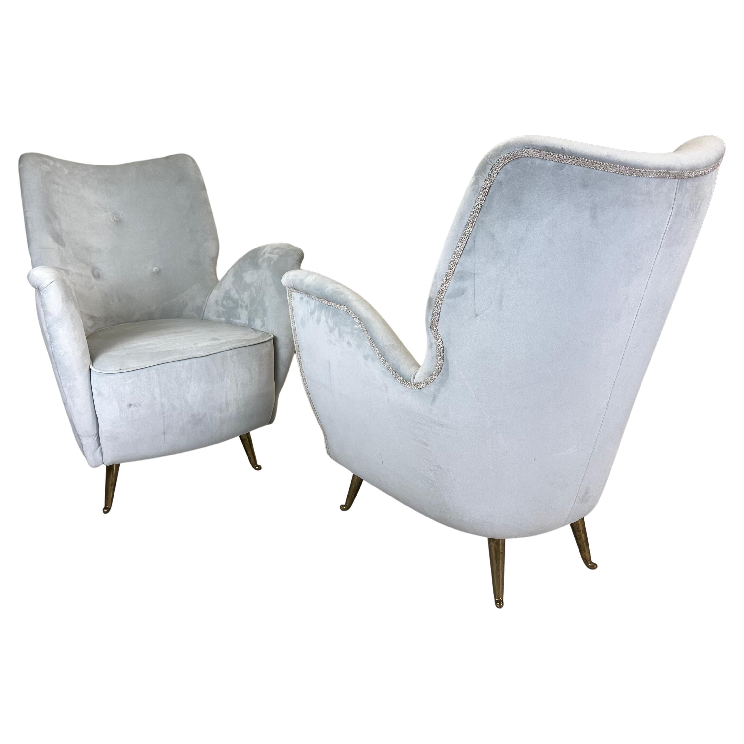 An Elegant and Timeless Pair of Italian Mid-Century Modern Lounge Chairs / Armchairs or Bed-side Chairs attributed to Gio Ponti and by ISA Bergamo. The chairs show a strong resemblance to other chairs that Gio Ponti designed for ISA Bergamo circa