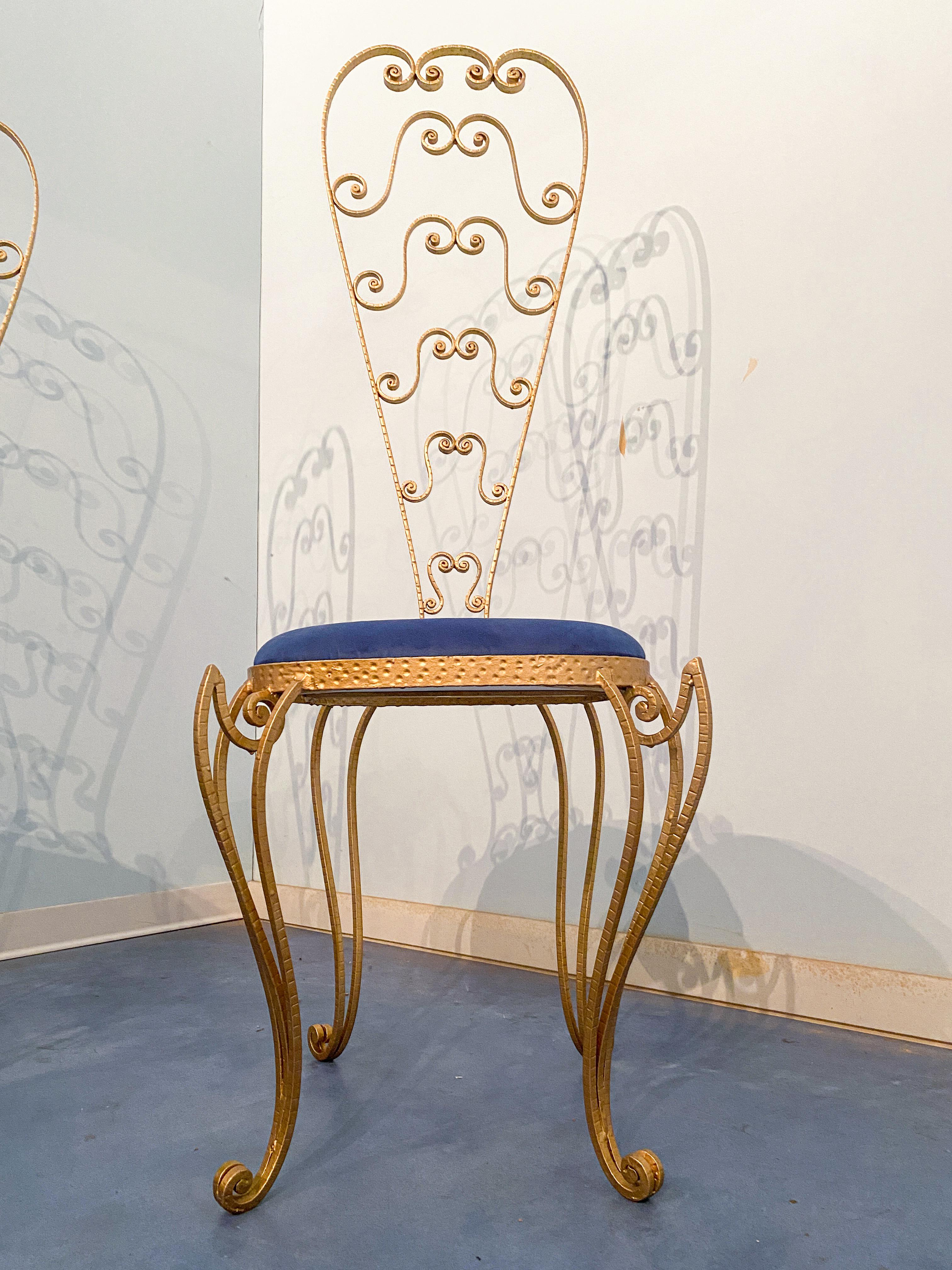 Apair of stunning Italian Mid-Century Modern chairs, look no further than these Luigi Colli vanity chairs. Made from gold gilded iron and featuring a high backrest, these chairs are as beautiful as they are functional. The deep blue microfiber