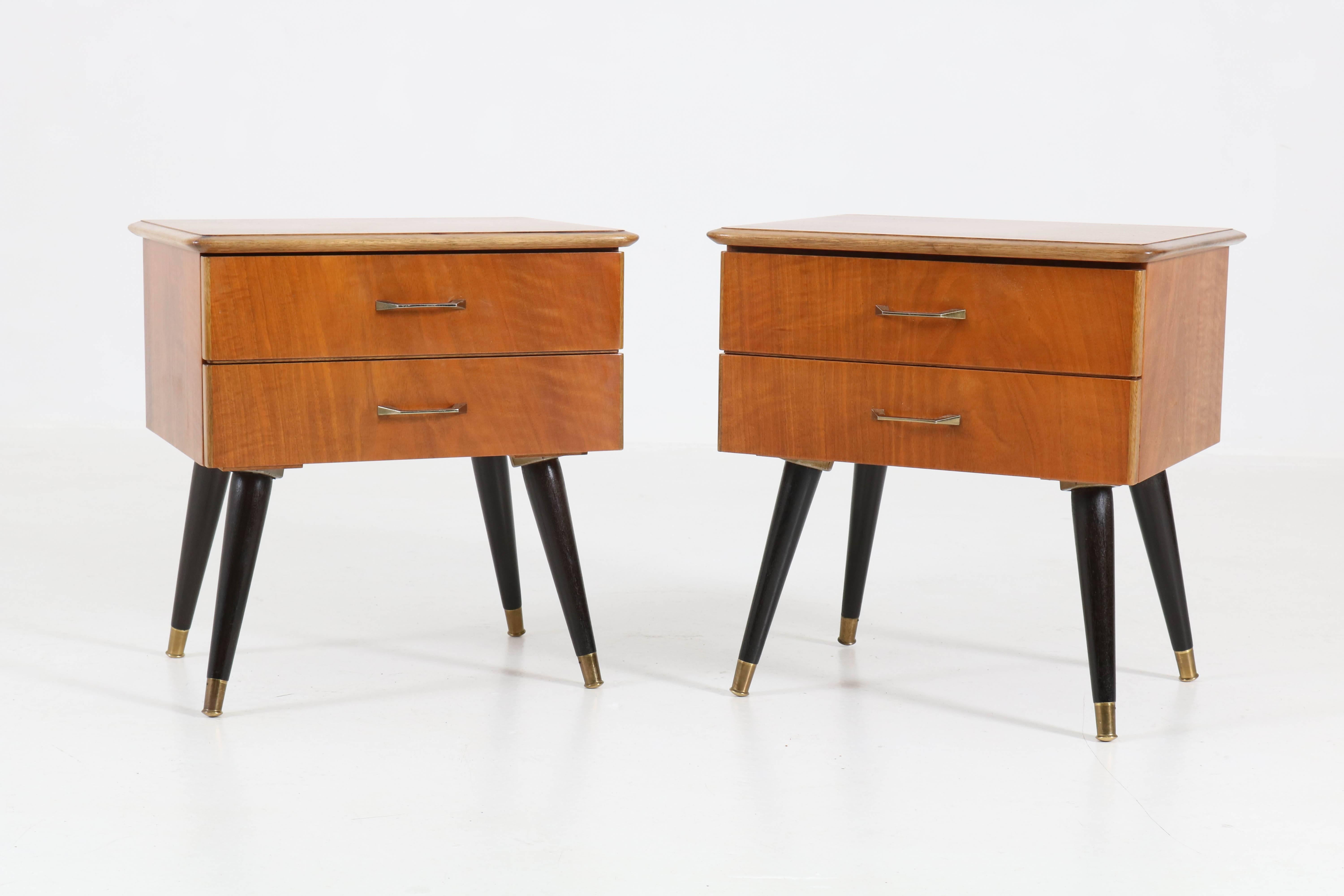 Elegant pair of Mid-Century Modern nightstands or bedside tables, 1950s.
Sleek Italian design from the 1950.
Walnut with original ebonized legs.
In good original condition with minor wear consistent with age and use,
preserving a beautiful