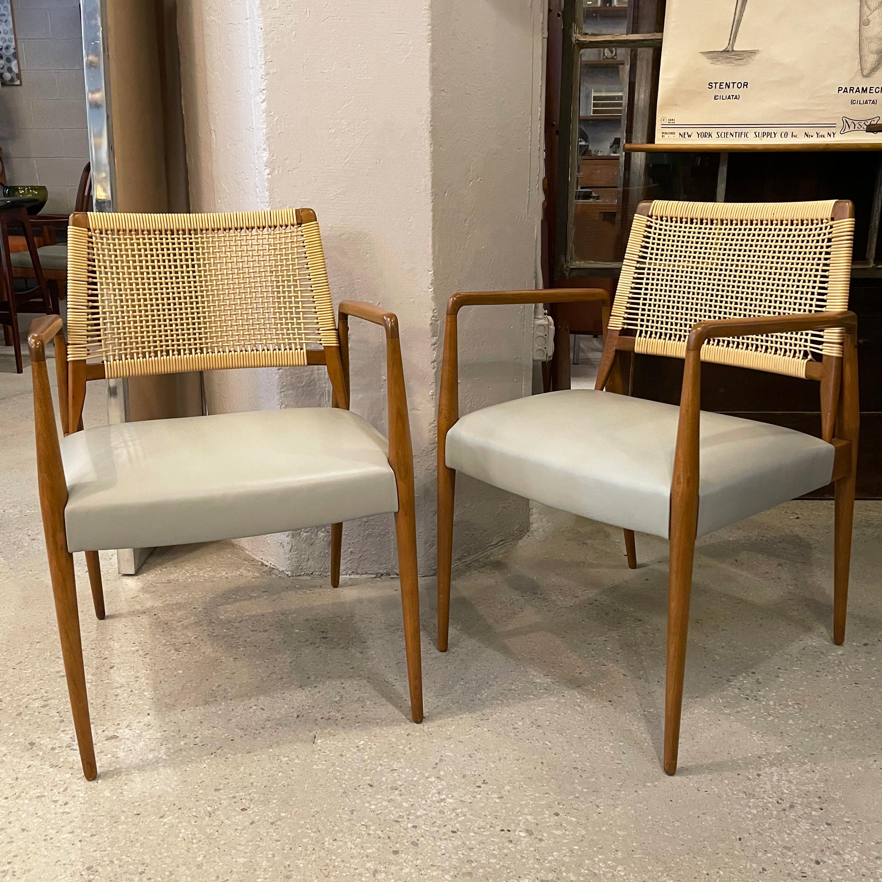 Stunning pair of Italian, Mid-Century Modern, armchairs feature sculptural beech frames with baby blue leather seats and woven rattan backs.