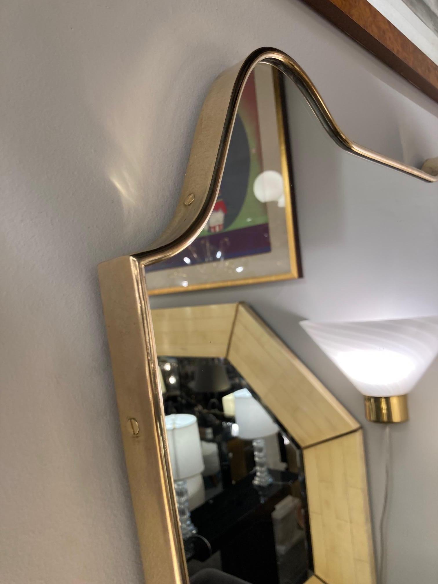 Pair of Italian Mid-Century Modern Sculptural Amorphic Brass Wrapped Mirrors In Excellent Condition In New York, NY