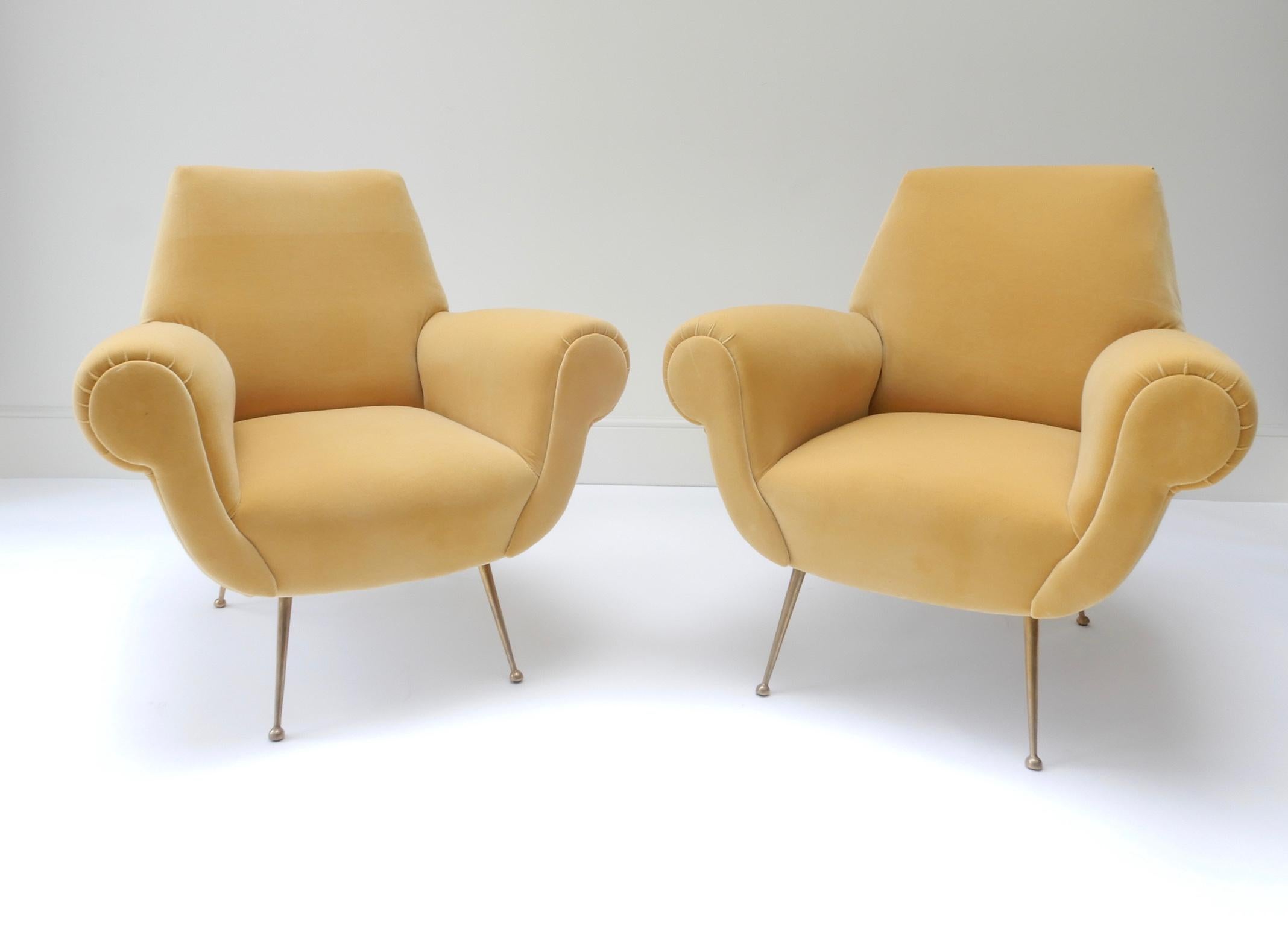 Pair of Mid-Century Modern style armchairs in yellow velvet.