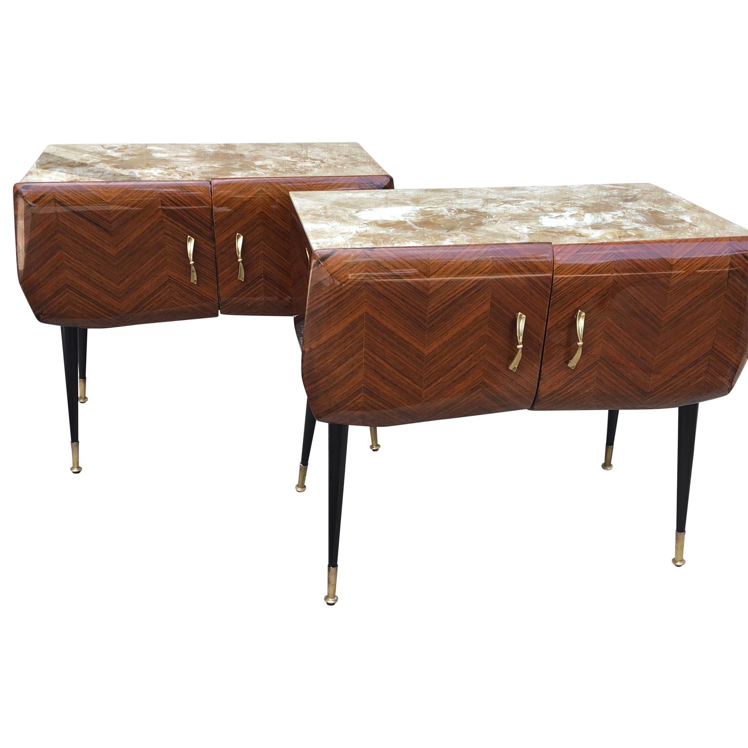 Pair of Italian midcentury bedside tables with two doors by Vittorio Dassi of Milano.

Tables has the original glass top and brass feet.