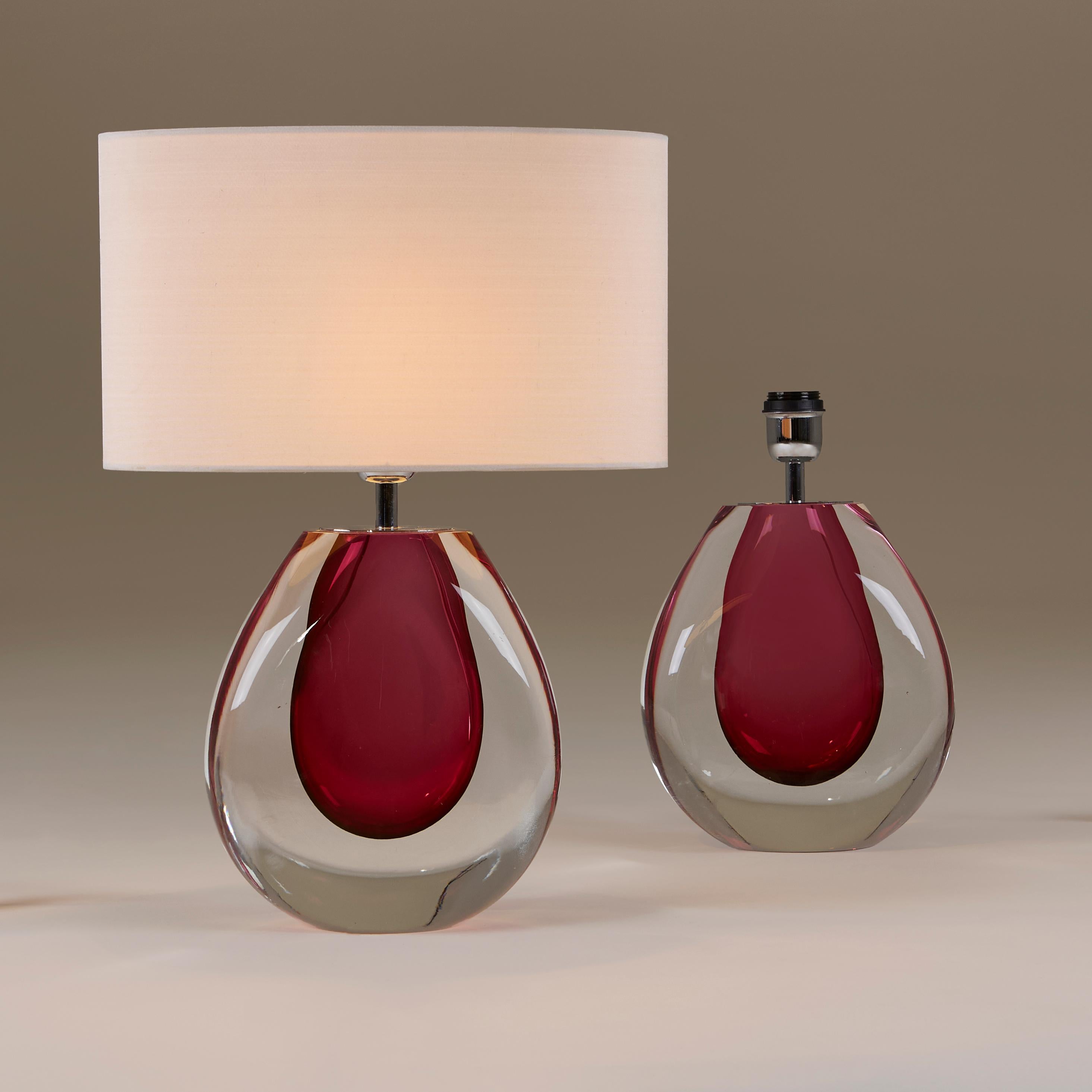 Elegant and substantial large pair of almond shaped handblown Seguso table lamps in rich raspberry and clear Murano glass with chrome fitting.

52cm high with shades. 

Shades are available upon request.

