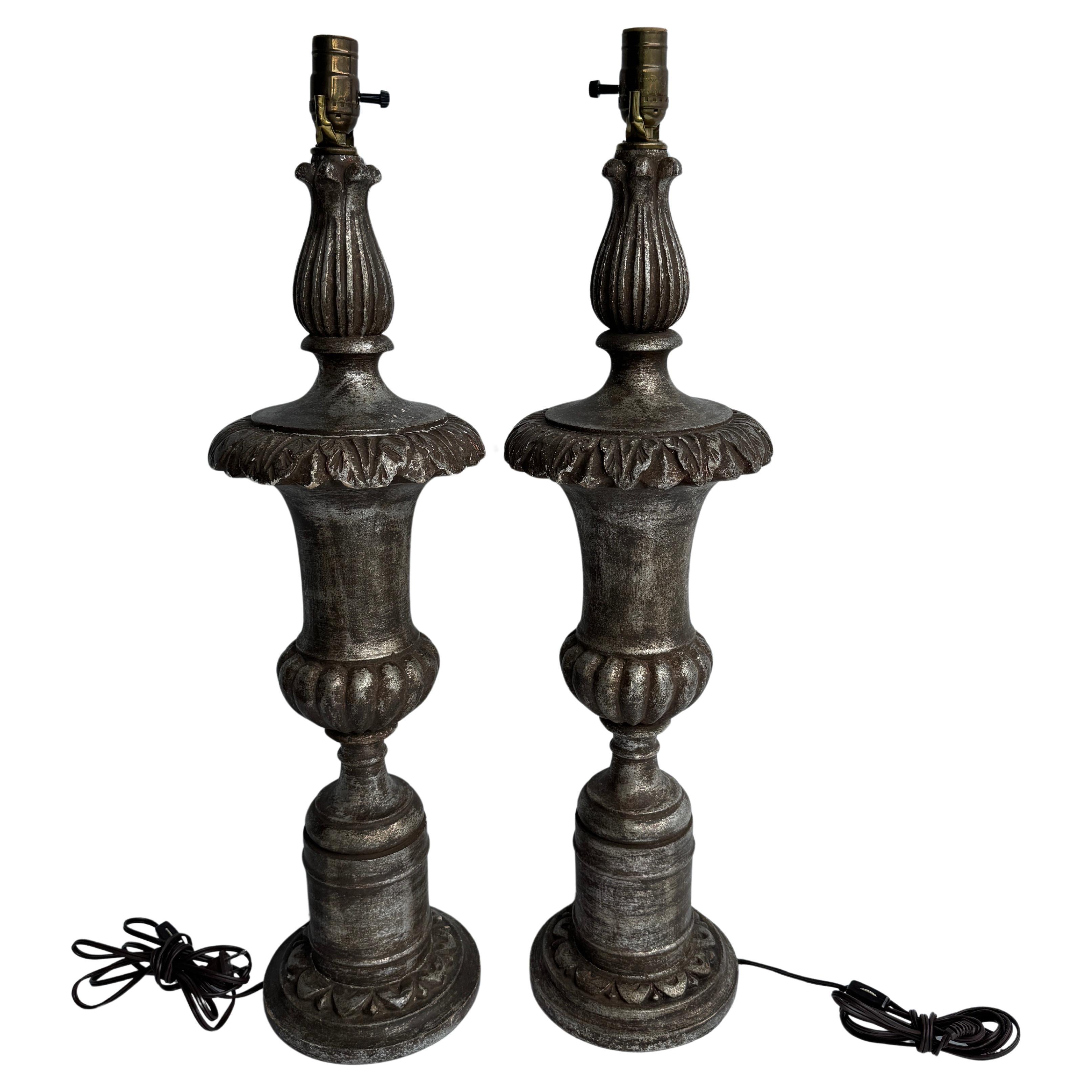 Mid Century Silver Leaf Table Lamps, A Pair 

Fantastic pair of carved wood, silver gilded, urn-form table lamps from Italy circa 1980's. Wonderful set of lamps for any living room or bedroom setting. 