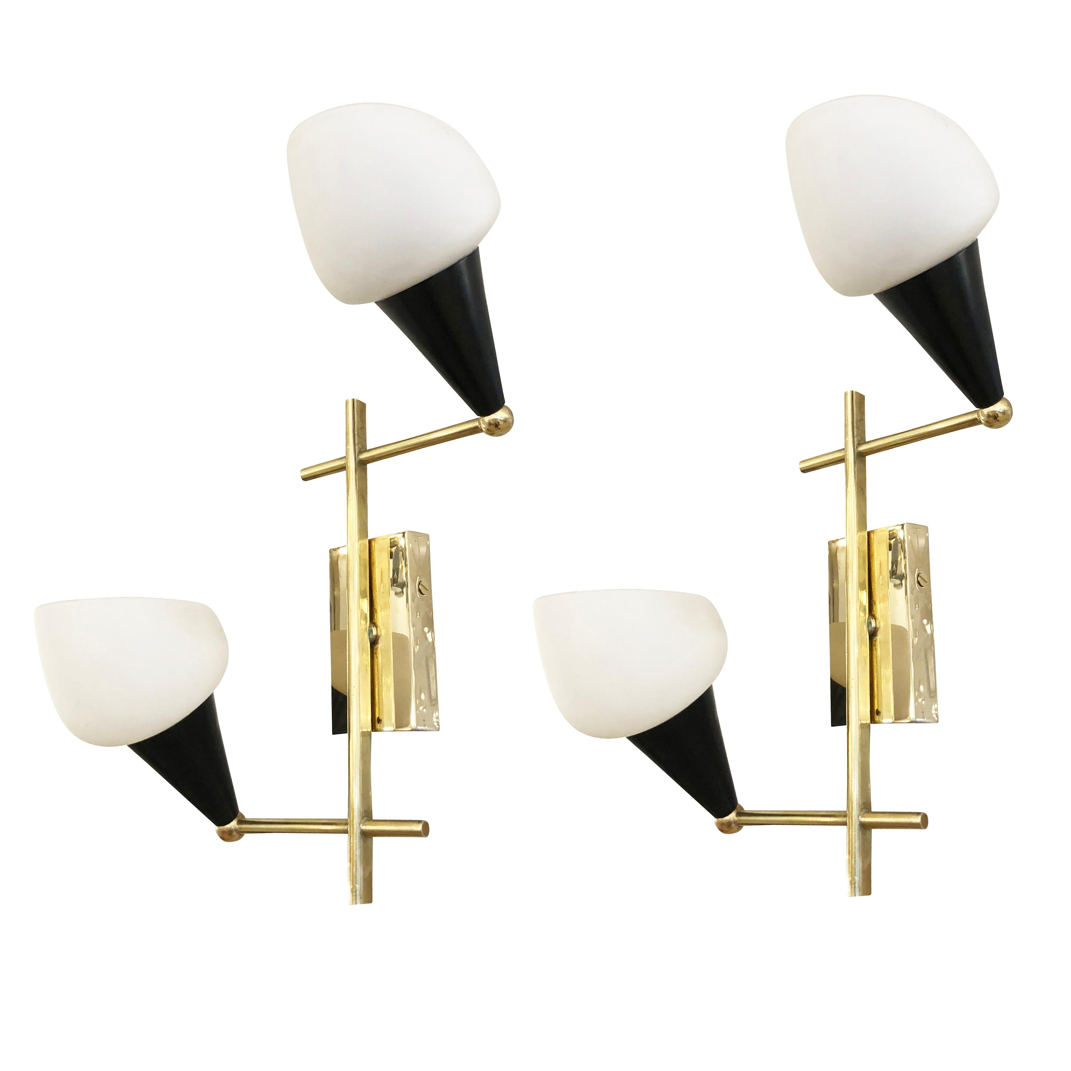 Pair of Italian midcentury wall lights with staggered frosted glass shades on a brass and black lacquered frame. Each holds two candelabra sockets.

Condition: Excellent vintage condition, minor wear consistent with age and use

Measures: Width