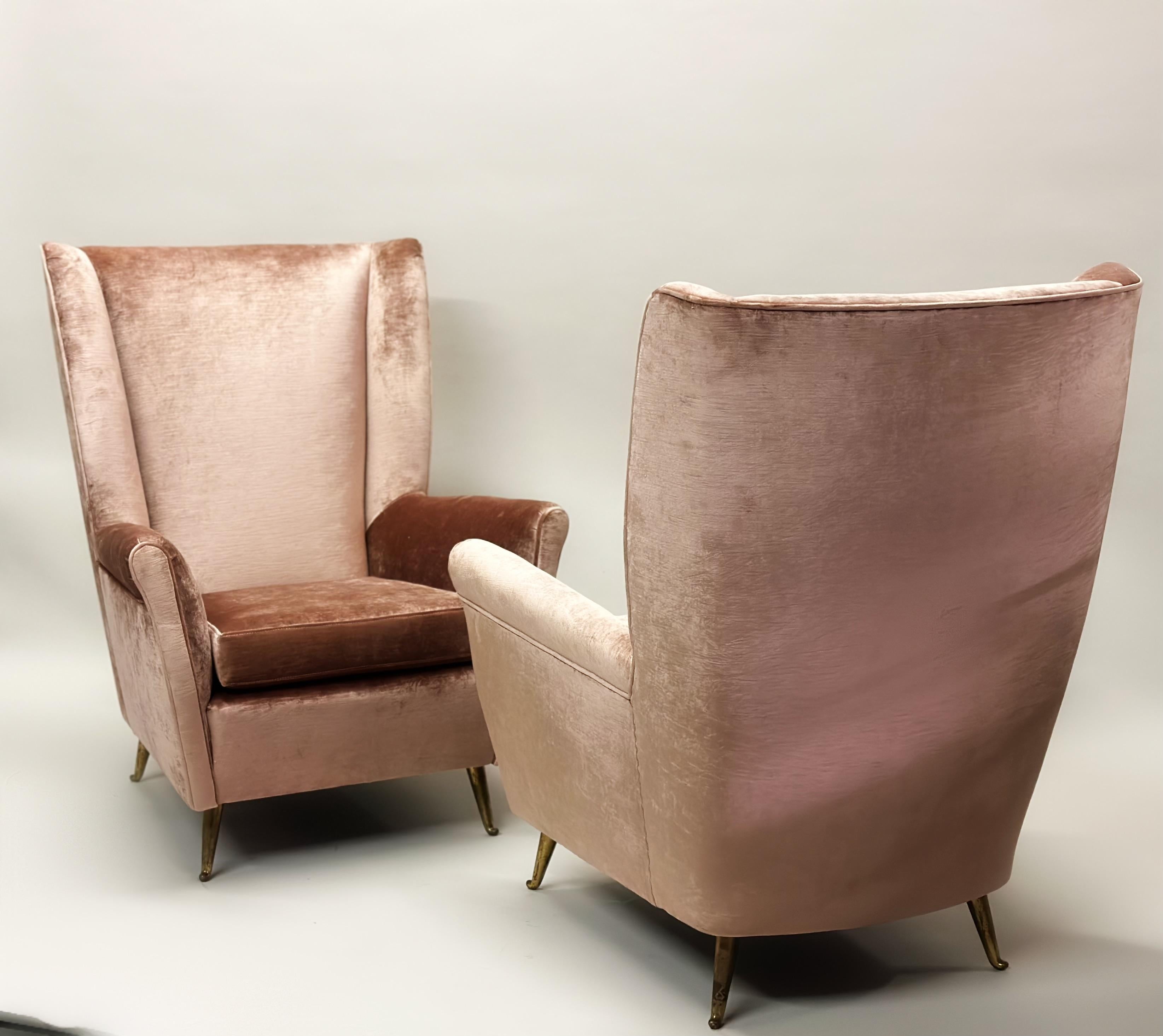 Elegant Pair of Italian Mid-Century Modern Hi-back Lounge chairs or Wingback Armchairs by ISA Bergamo and attributed to Gio Ponti as model # 512 for ISA.. Recently re-upholstered in Italy. 

Gio Ponti was known for working in the Modern Neoclassical