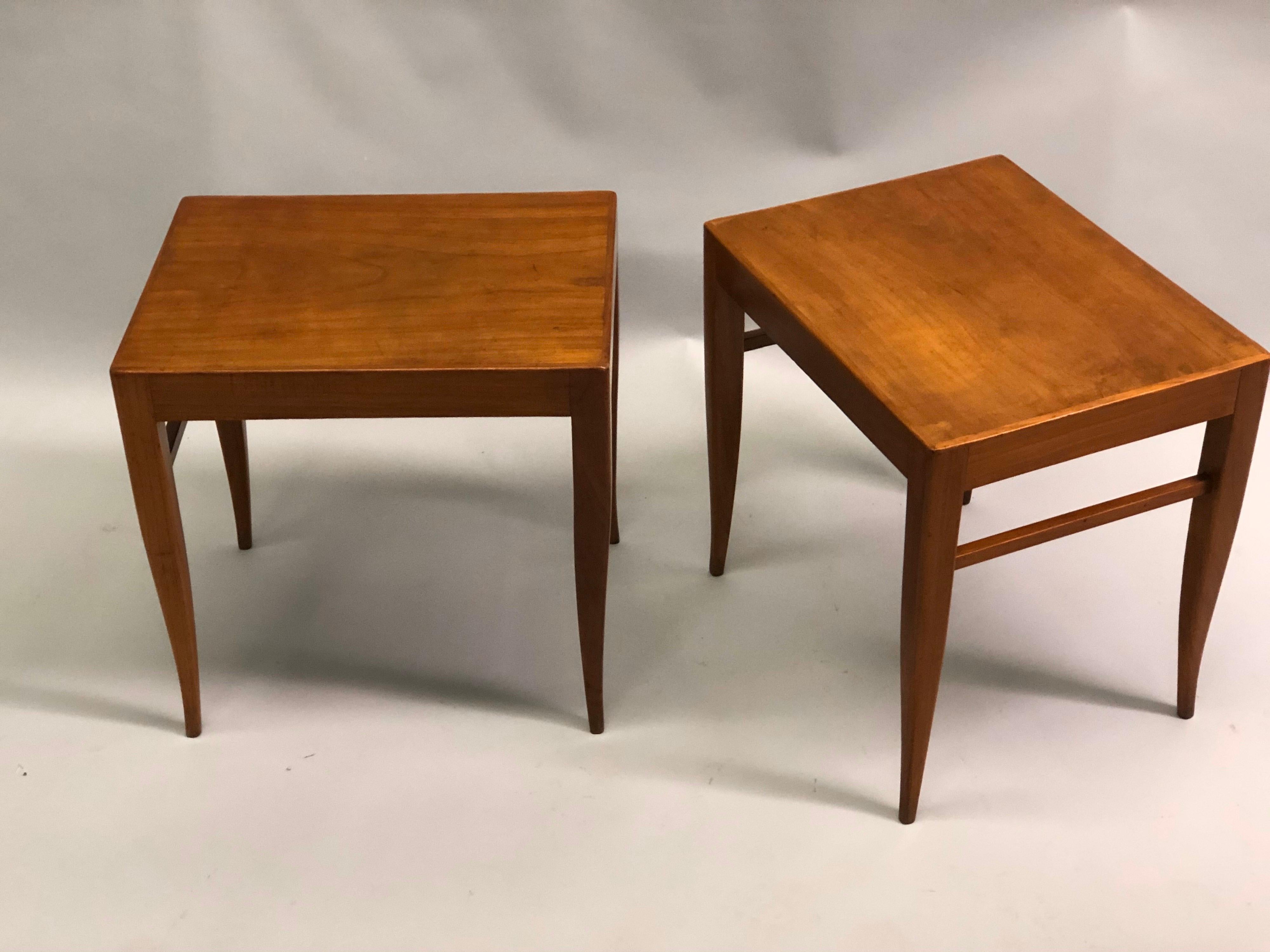 Elegant and timeless pair of Italian Mid-Century Modern craftsman carved cherry wood benches or stools from the circle of Gio Ponti and his work at the hotel, Hotel Parco di Principe, Italy, 1954. These are rare, handmade pieces expressing purity