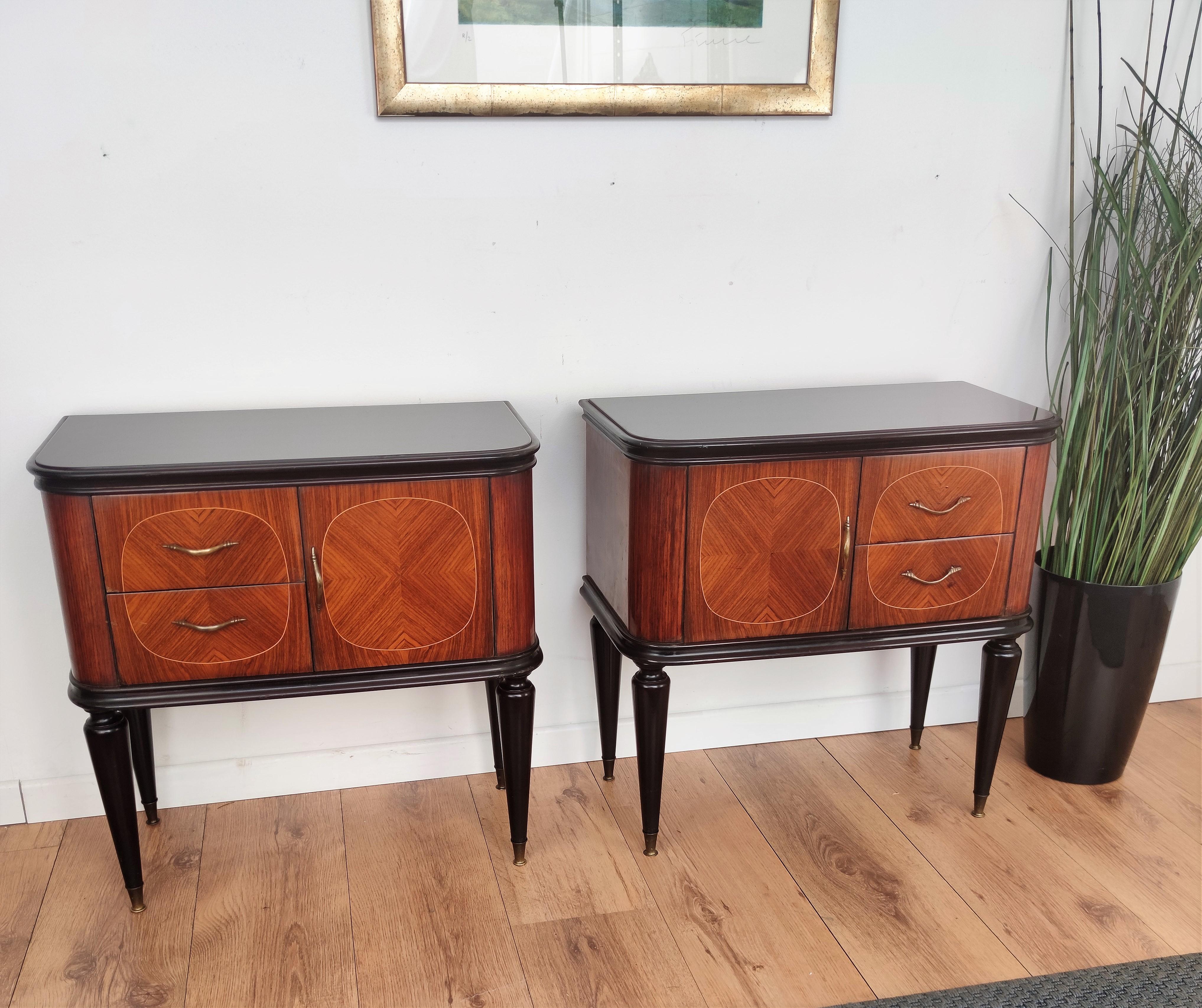 Very elegant and refined Italian 1950s pair of bed side tables with front door and great pattern decor design of the walnut veneer wood with one front door and two drawers. Great finish such as the brass handles and leg ends and the beautiful framed