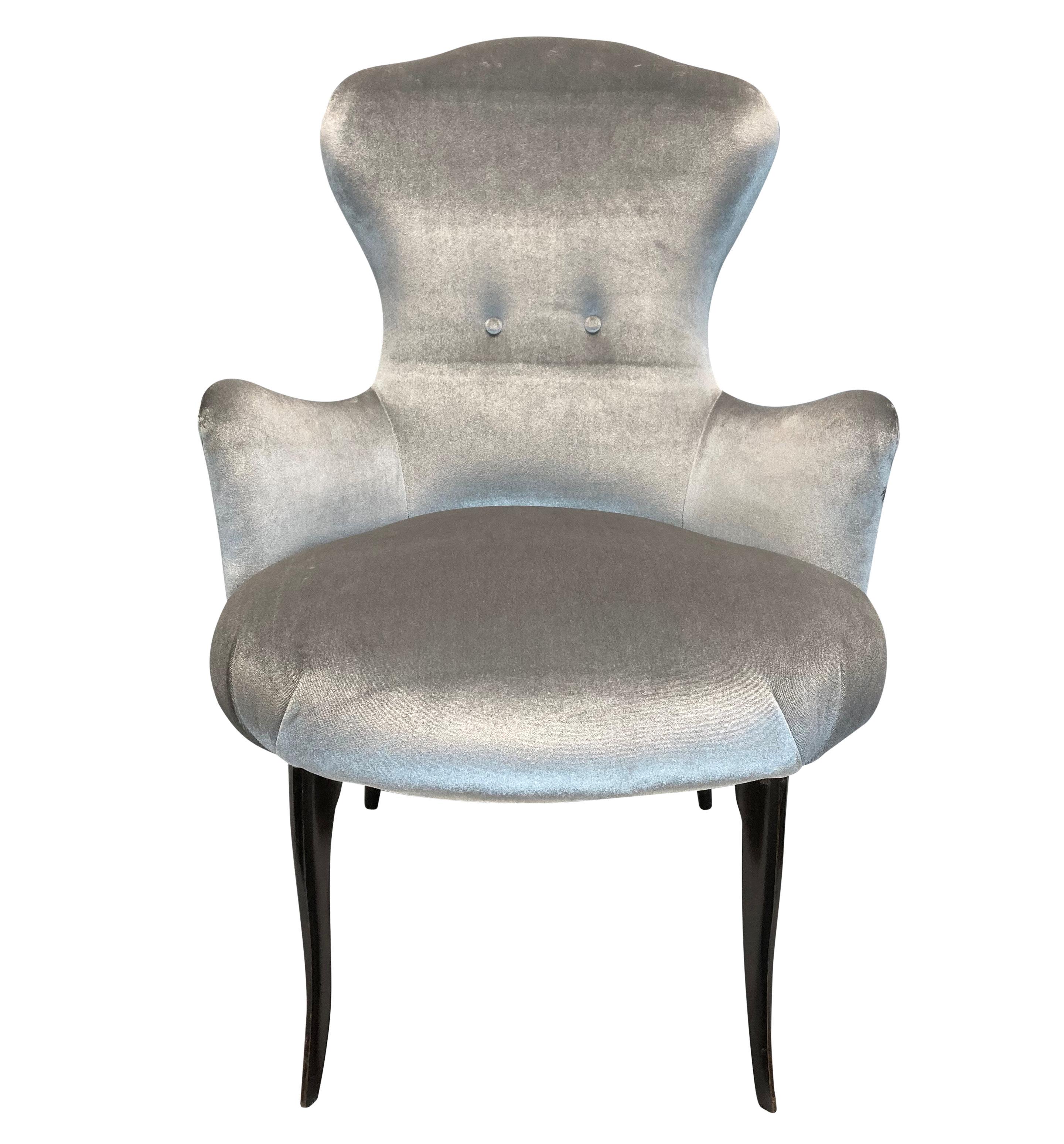 A pair of Italian Mid-Century bedroom chairs of elegant proportions, with ebonised cabriole legs and newly upholstered in silver velvet.
